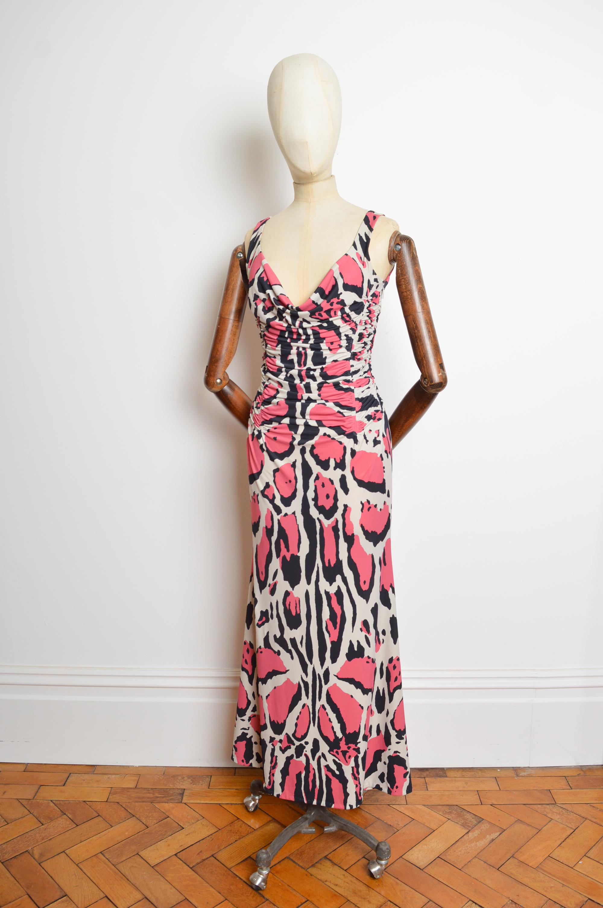 Fabulous 2009 Roberto Cavalli Pink Jaguar patterned dress with ruched detailing, fitted waistline and floor length hem. The Material is both stretchy and comfortable and the Roberto Cavalli signature can be seen discretely placed amongst the