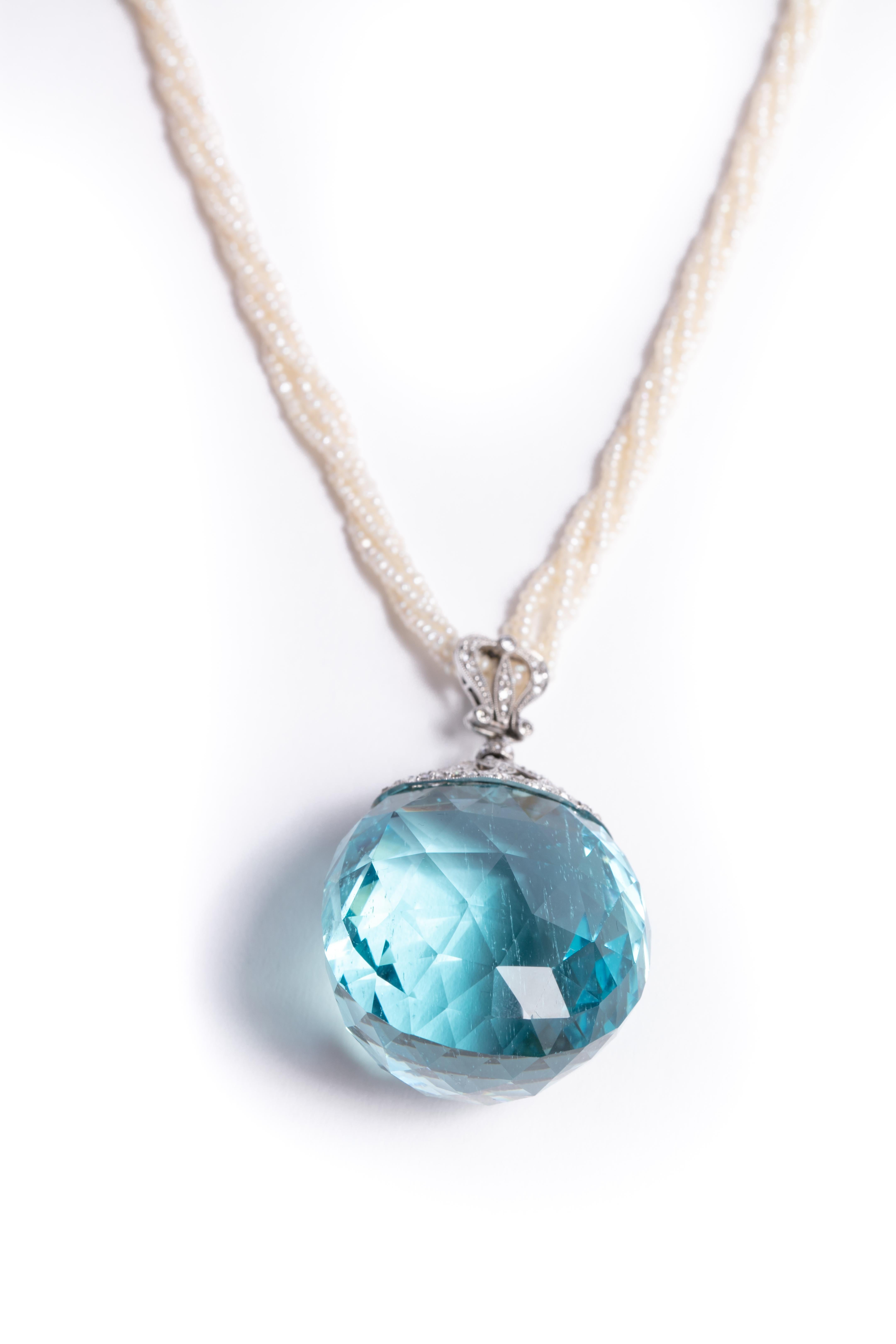 An absolutely stunning 200ct hand - faceted aquamarine pendant, estimated to be from the 1870's suspended by the original seed pearls which have been restrung.
This detachable pendant looks amazing accented by the pearls but would be equally