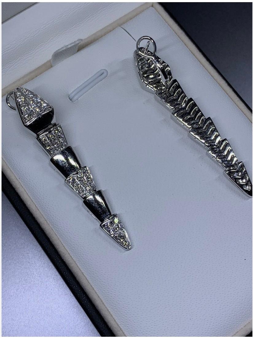 2.00ct Diamond art deco drop dangle earrings 18ct white gold 13.2g
2.00ct Round diamond drop earrings in 18k white gold.

Diamond chunky snake serpentine style drop dangle long earrings in 18ct white gold.

Fine quality diamonds drop earrings snake