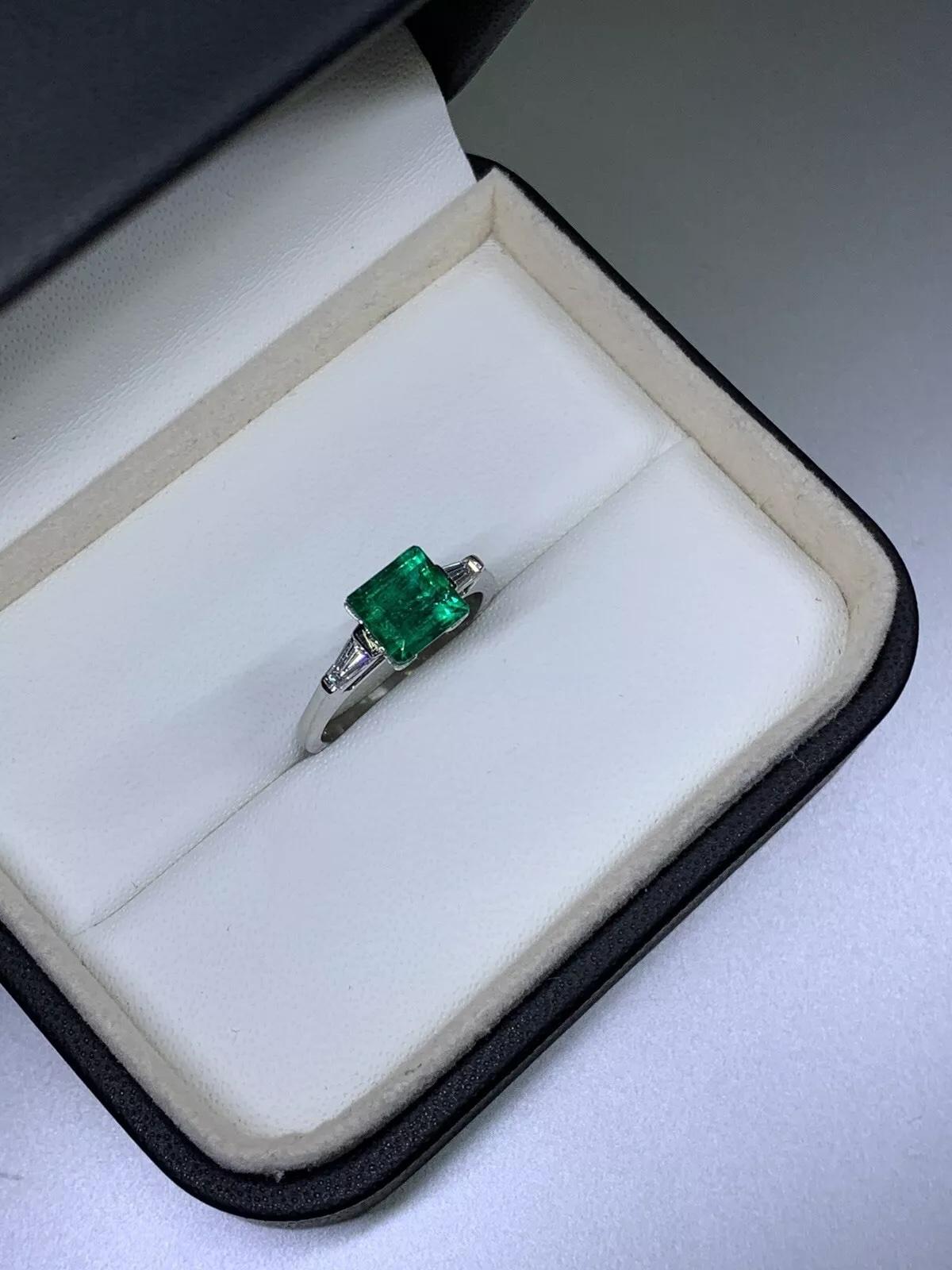 2.00ct Diamond baguette emerald green trilogy engagement ring in platinum.

Gorgeous green Colombian emerald princess cushion shaped with two baguette diamond step cut on the side trilogy engagement ring in platinum.

Natural green emerald total