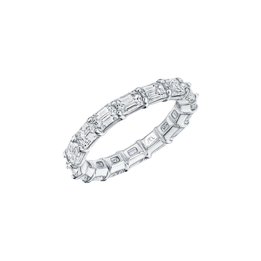 • Crafted in 18KT gold, this band is made with 19 horizontally set emerald cut diamonds, and has a combining total weight of approximately 2.00 carats. The diamonds are set into a shared prong setting. Worn beautifully on its own or stacked with