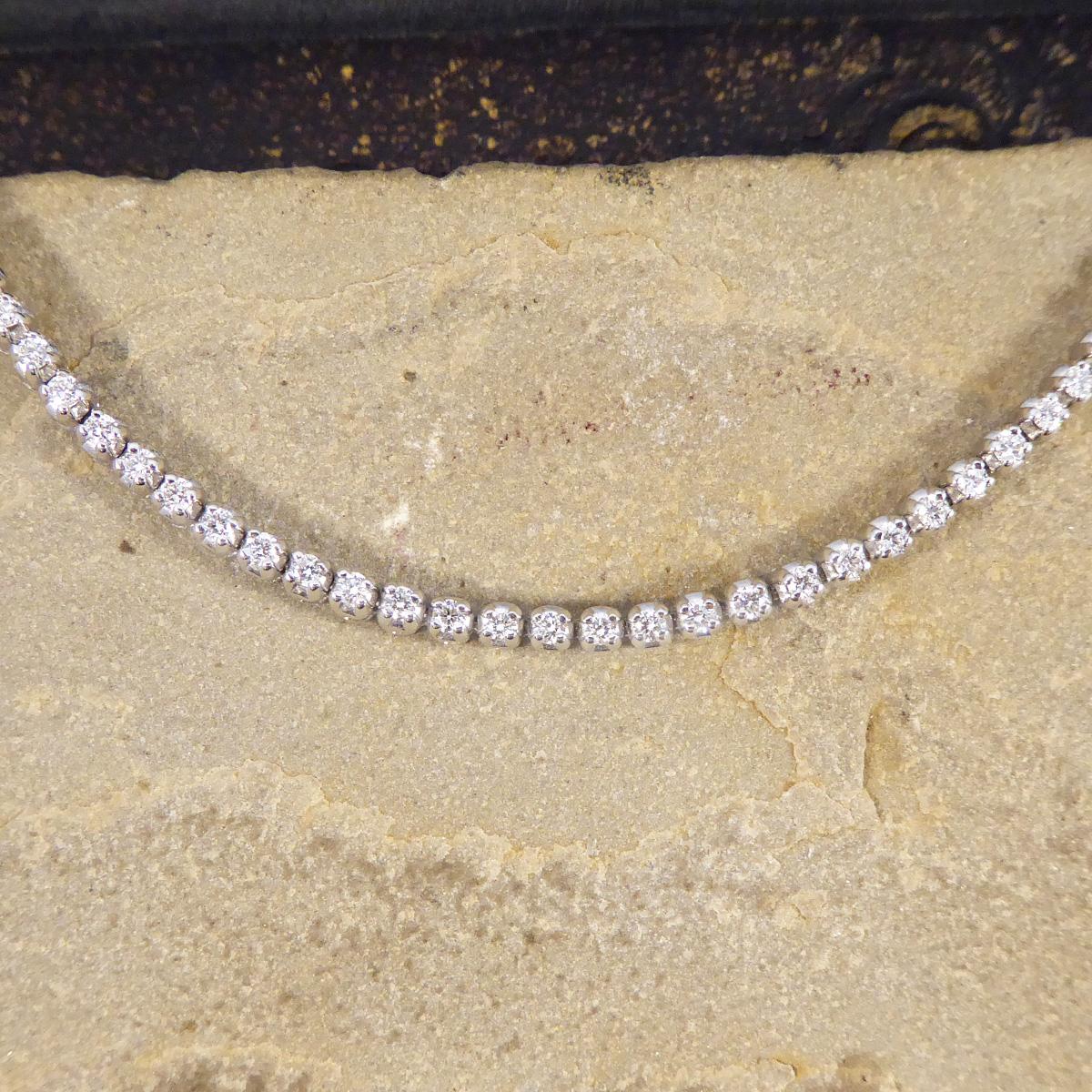 A classic, durable and easy to wear tennis bracelet. This tennis bracelet has been designed to be worn daily, it has a flexible link to take on any form and making the links wear less when worn. It holds 56 Round Brilliant Cut Diamonds that are set