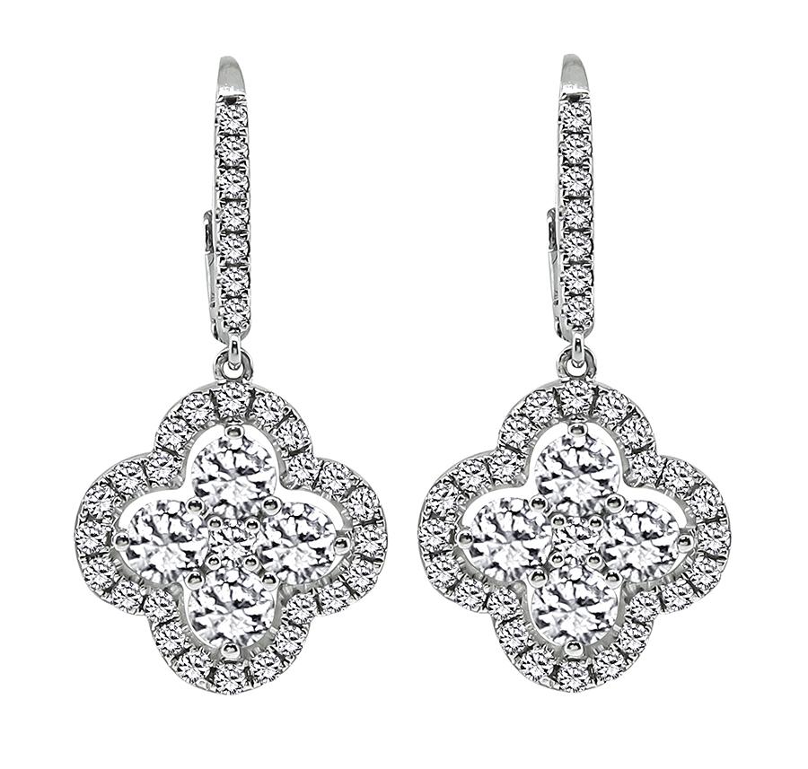 This is a gorgeous pair of 14k white gold earrings. The earrings feature sparkling round cut diamonds that weigh approximately 2.00ct. The color of these diamonds is I with SI clarity. The earrings measure 30mm by 14mm and weigh 3.8