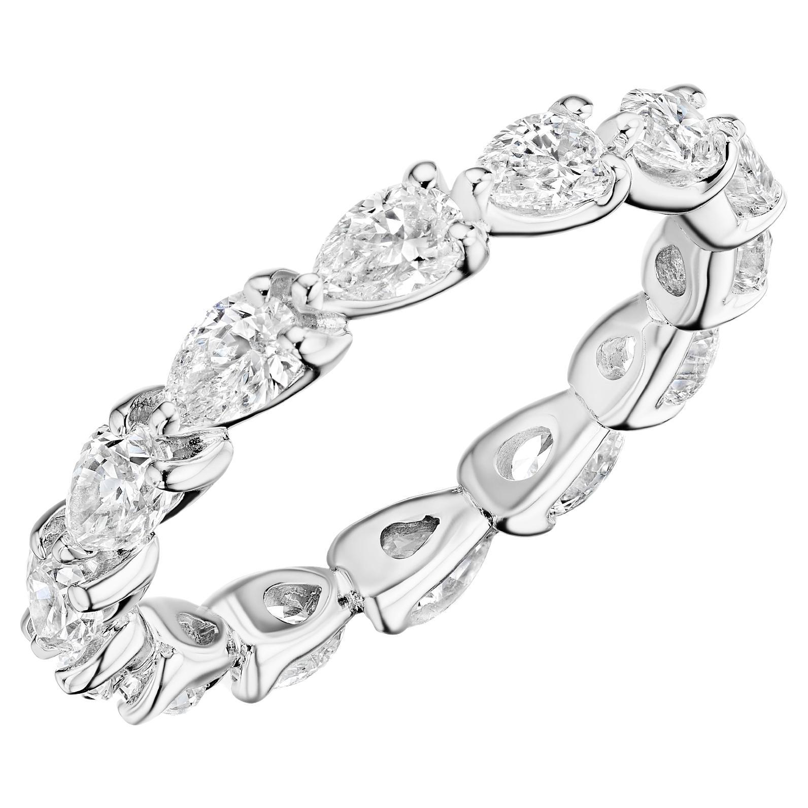 • Crafted in 18KT gold, this eternity band is made with 14 pear shape diamonds which encircle the finger, and has a combining total weight of approximately 2.00 carats. Worn beautifully on its own or stacked with additional rings.  A beautiful and