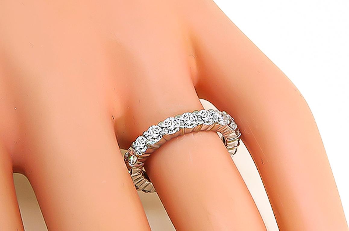 This is a fabulous 14k white gold eternity wedding band. The band is set with sparkling round cut diamonds that weigh approximately 2.00ct. The color of these diamonds is G with VS clarity. The band measures 3mm in width and weighs 3.3 grams. The