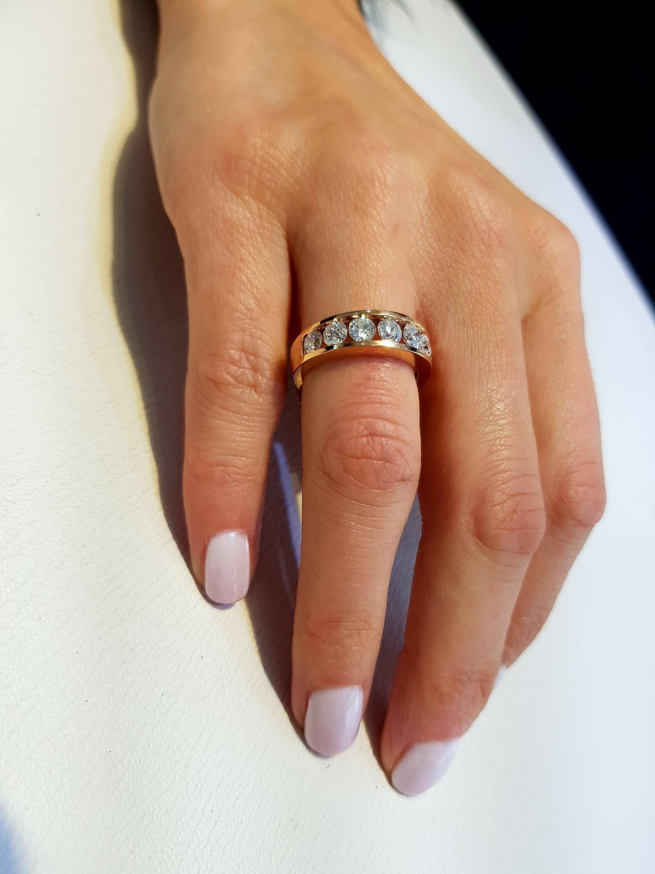 This channel set 18k rose gold half eternity ring is an exquisite addition to our collection. A sparkling array of nine H-SI1 diamonds are round cut for a classic and iconic eternity ring. This ring has a total diamond wright of 2.00ct. The weight