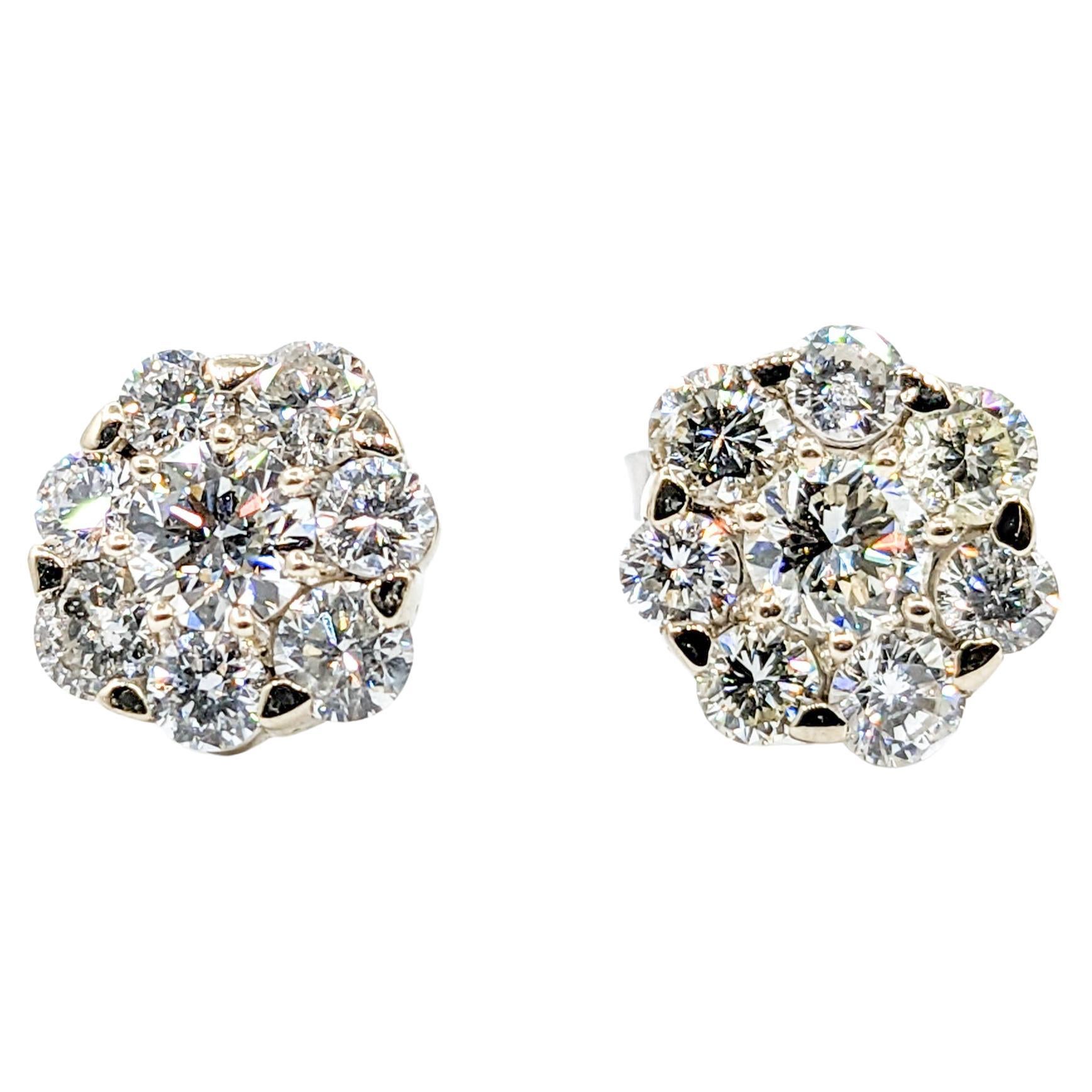 2.00ctw Diamond Cluster Stud Earrings in White Gold 

Discover elegance redefined with these exquisite earrings, masterfully crafted in 14kt white gold. Each earring showcases a stunning array of 2.00ctw round diamonds, brilliantly sparkling with SI