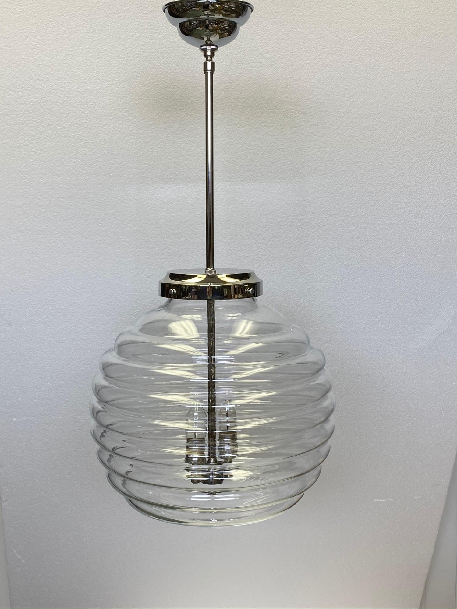 Large Murano hand blown beehive glass pendant light with nickel over brass fitter from the early 2000s. Uses two standard base bulbs. Cleaned and rewired. Small quantity available at time of posting. Priced each. Please inquire. Please note, this