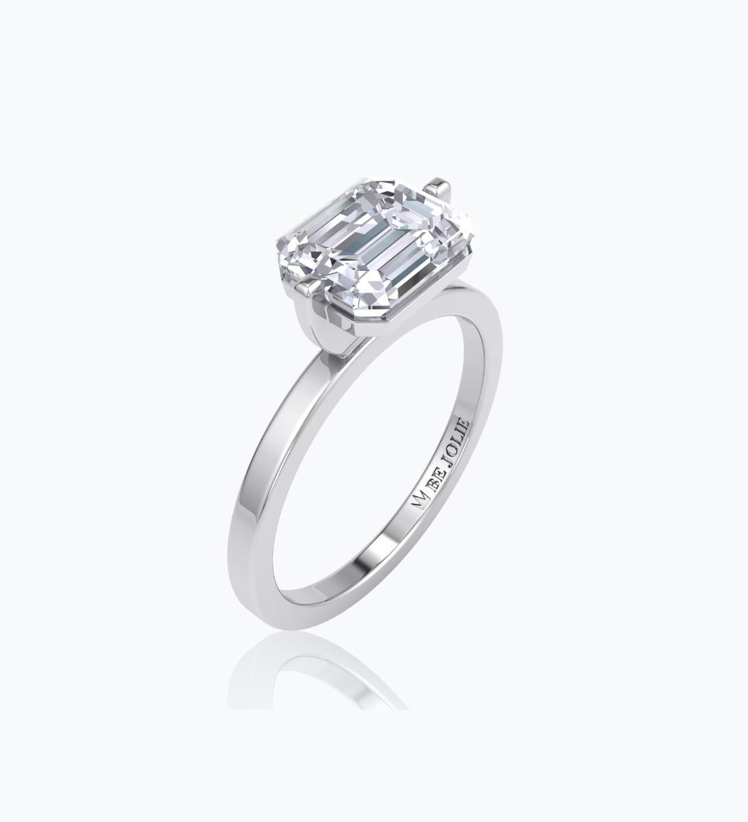 Handcrafted Solitaire Engagement Ring centers a 2.01 Carat Emerald cut diamond  G-H / VS22 and mounted on 18K White Gold. 
Ring Size 6.5 and can be resized. 
Our ring is custom made. Since beautiful jewels takes time to create, our lead time may