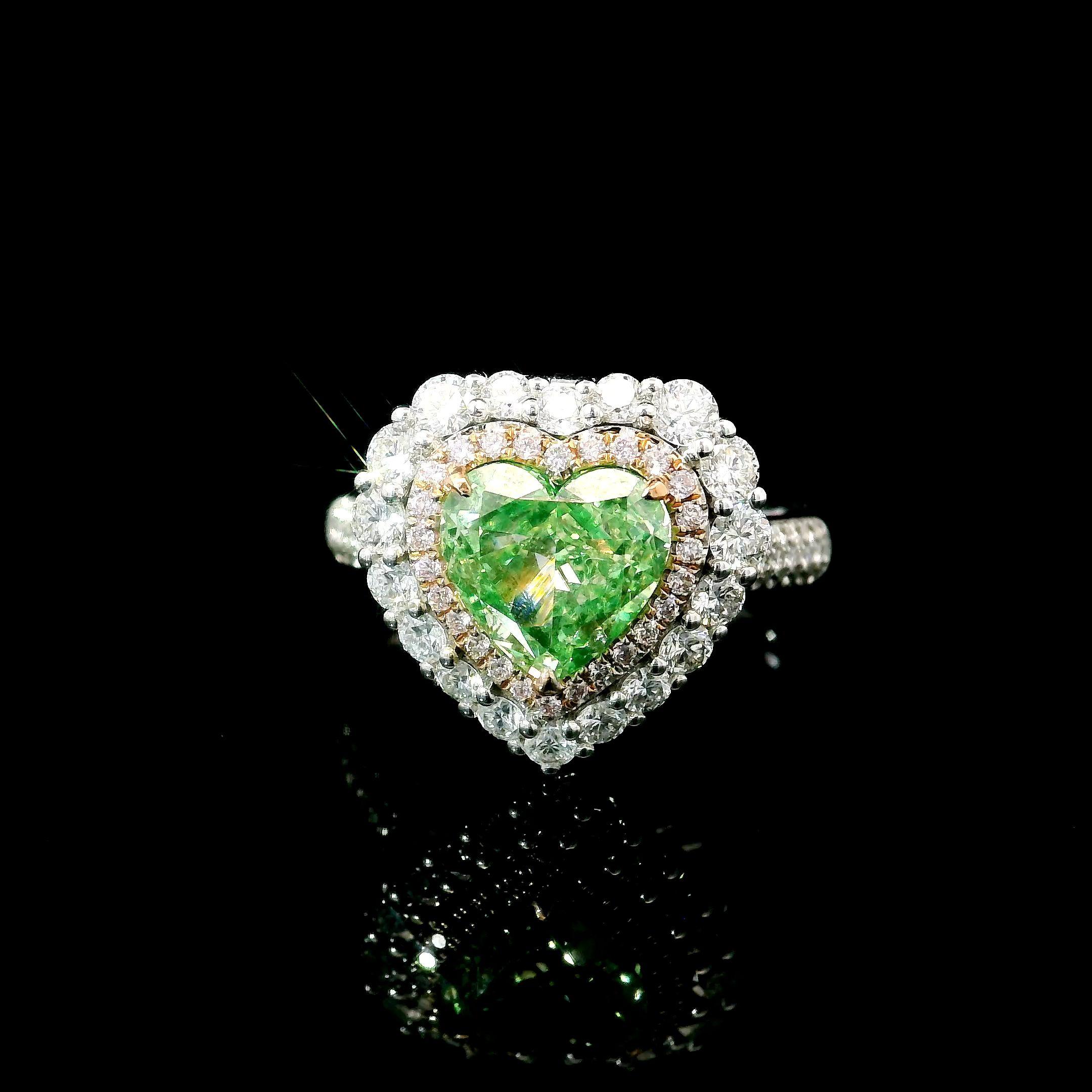 18kt white gold ring with diamonds
  
  Gold colour & karat: White gold 18kt
  Weight: 5.46 grams
  
  Set with-
  Stone type: Diamonds
  Shape: Heart
  Carat: 2.01 ct
  Colour: Fancy Light Brownish Greenish Yellow
  Clarity: VS2
  
  Surrounding