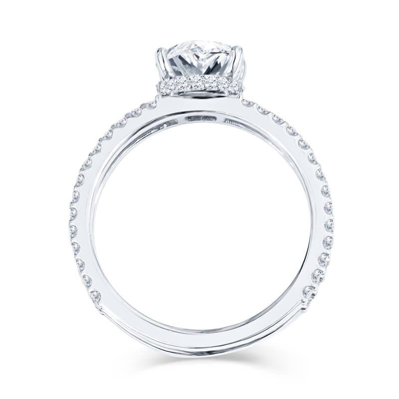 Beautiful lady’s engagement ring featuring a 2.01 carat oval cut diamond (J color, VS2 clarity) set in 18kt white gold. This engagement ring features a double shank that has an additional .59 carat of diamond wrapping around, with the diamond