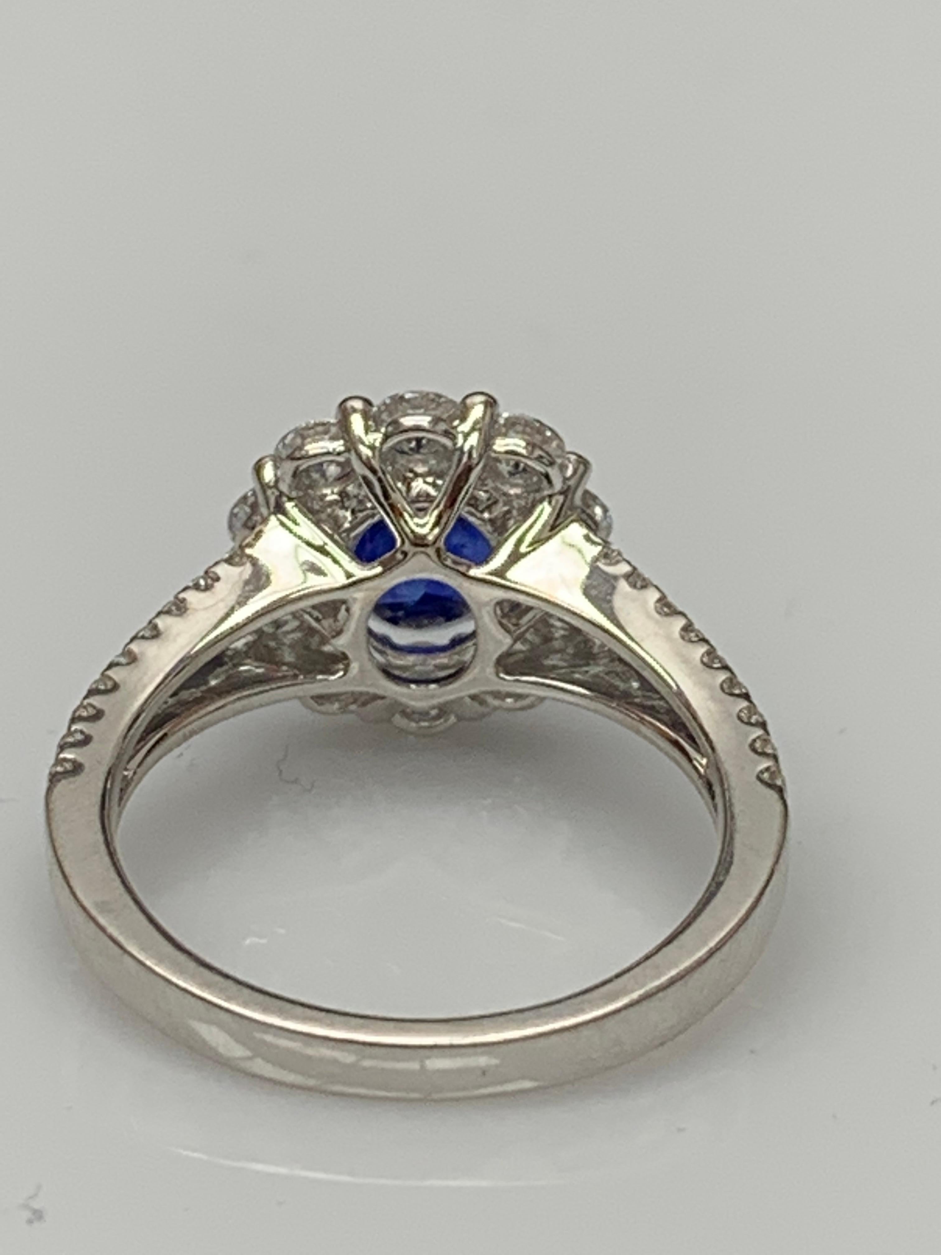 Contemporary 2.01 Carat Oval Shape Blue Sapphire and Diamond Flower Ring in 18K White Gold For Sale
