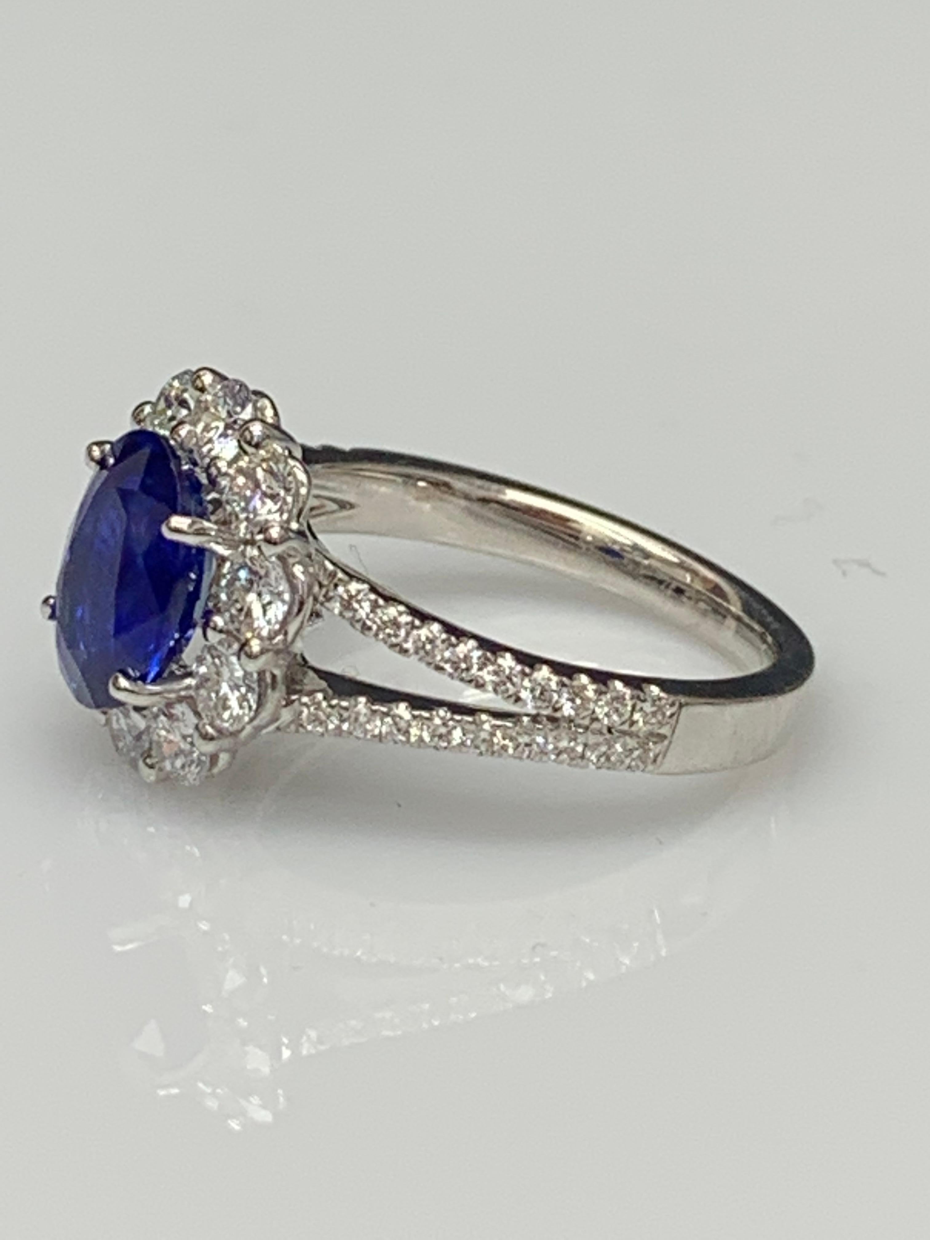 Oval Cut 2.01 Carat Oval Shape Blue Sapphire and Diamond Flower Ring in 18K White Gold For Sale