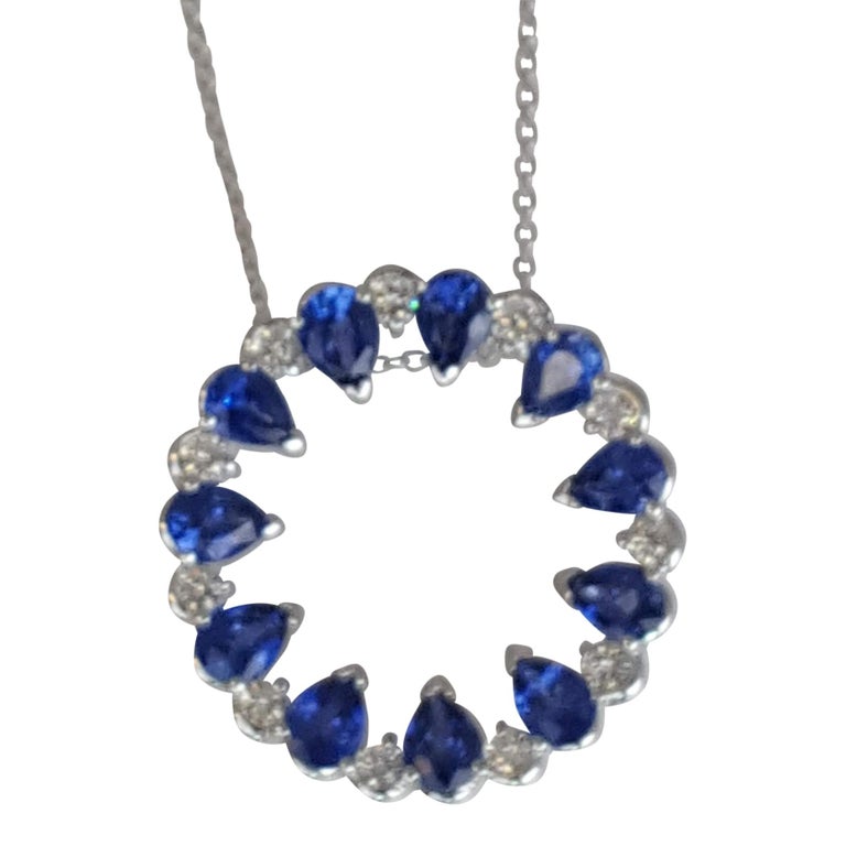 This beautiful sapphire pendant features eleven pear shaped blue sapphires alternating with eleven round white diamonds, to form a round ring. The total sapphire weight is 2.01 carats, and the total diamond weight 0.25 carats.

Set in 18k