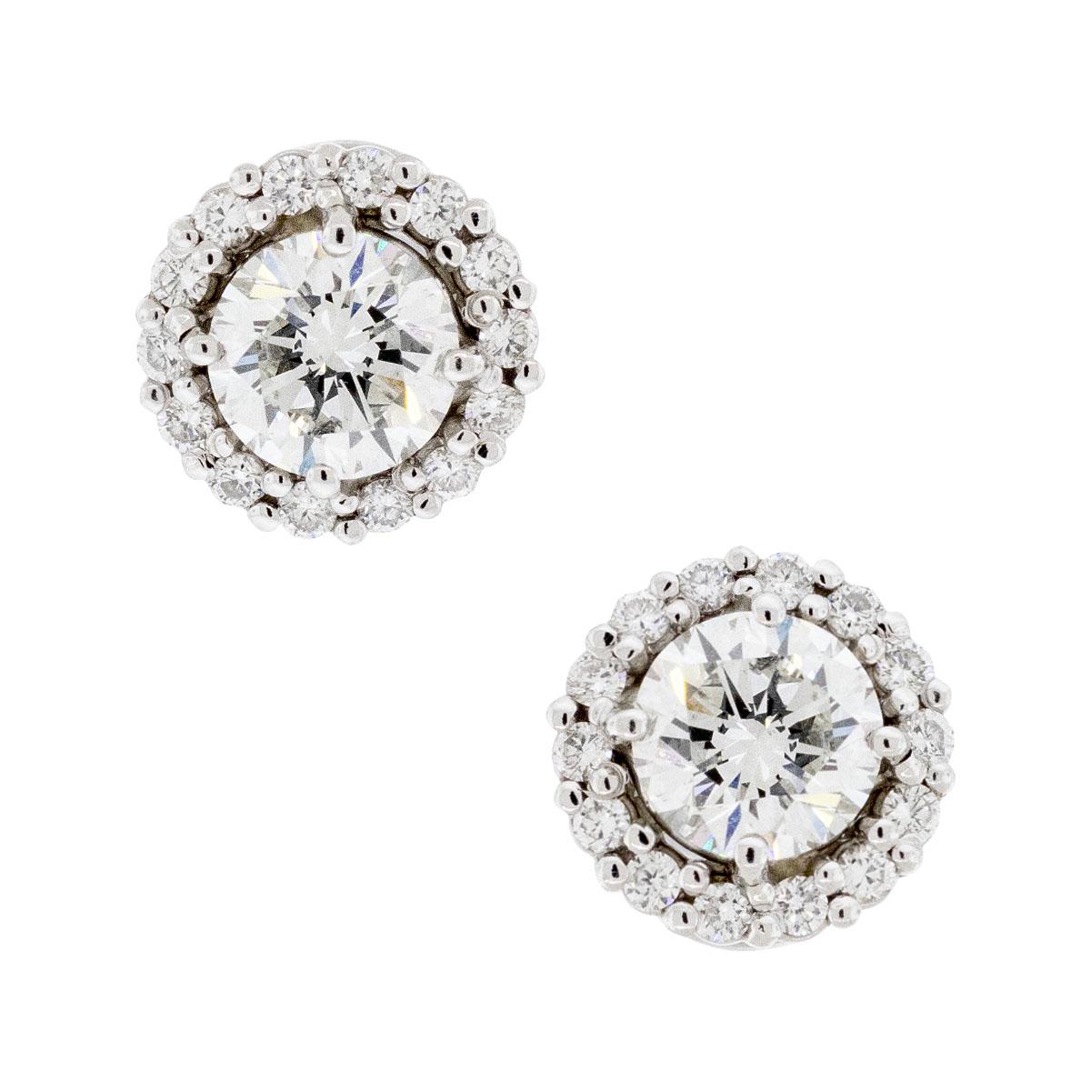 Company: N/A

Style of jewelry: Round cut diamond stud earrings

Material: 14k white gold

Stones: Two natural round cut diamonds that are G in color and SI in clarity.
GIA report # 5136898543, 6204026599

Dimensions: 16mm x 10mm

Weight: 4g