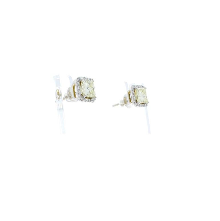 Contemporary 2.01 Carat Total Fancy Yellow Princess Cut Diamond Stud Earrings