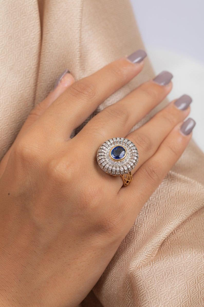 This ring has been meticulously crafted from 14-karat gold.  It is hand set with 2.01 carats blue sapphire & 1.22 carats of sparkling diamonds. 

The ring is a size 7 and may be resized to larger or smaller upon request. 
FOLLOW  MEGHNA JEWELS