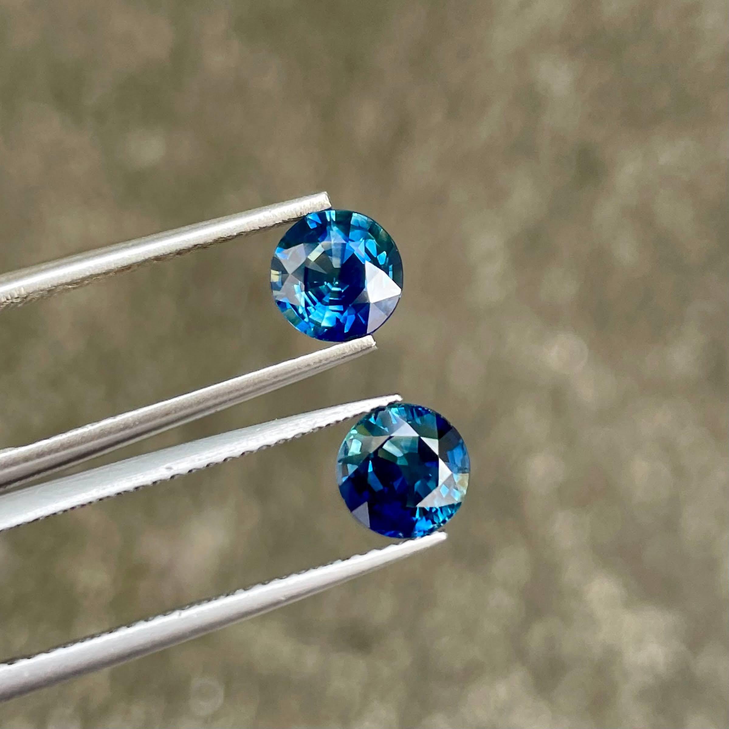 Weight 2.01 carats (for pair)
Dimensions 6.1x6.0x3.5 mm
Treatment heated
Clarity VVS
Origin Madagascar 
Shape round 
Cut round brilliant 




Behold the mesmerizing beauty of a 2.01 carat pair of Teal Blue Sapphires, impeccably crafted in a Round