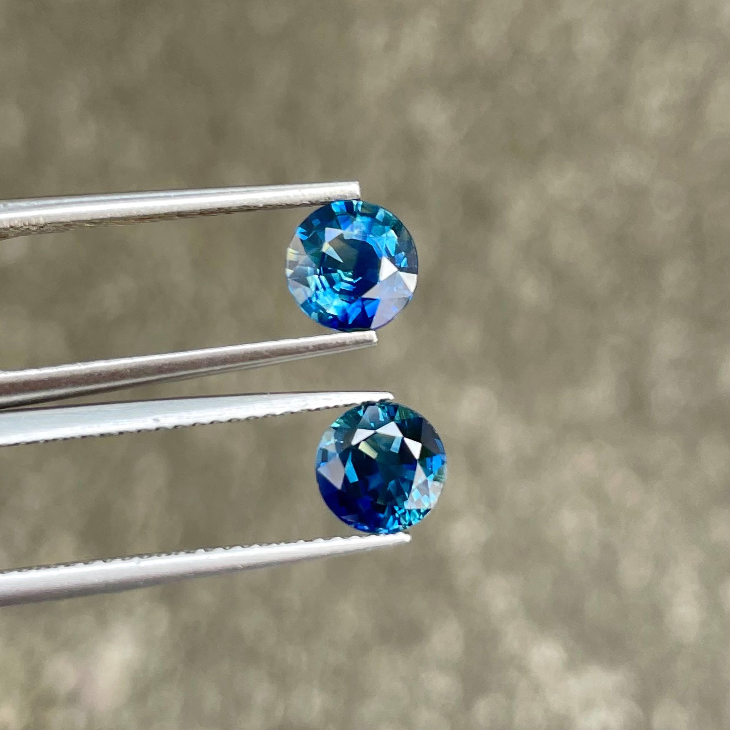 Modern 2.01 carats Teal Blue Sapphire Pair Round Cut Natural Madagascar's Gemstone For Sale