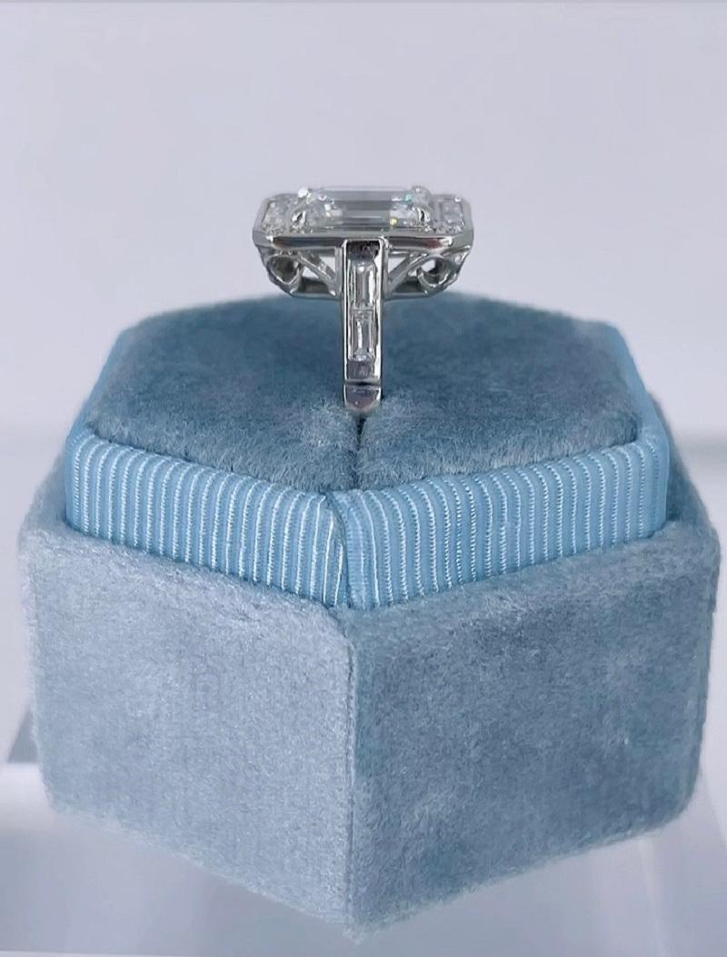 emerald cut engagement ring with baguette halo