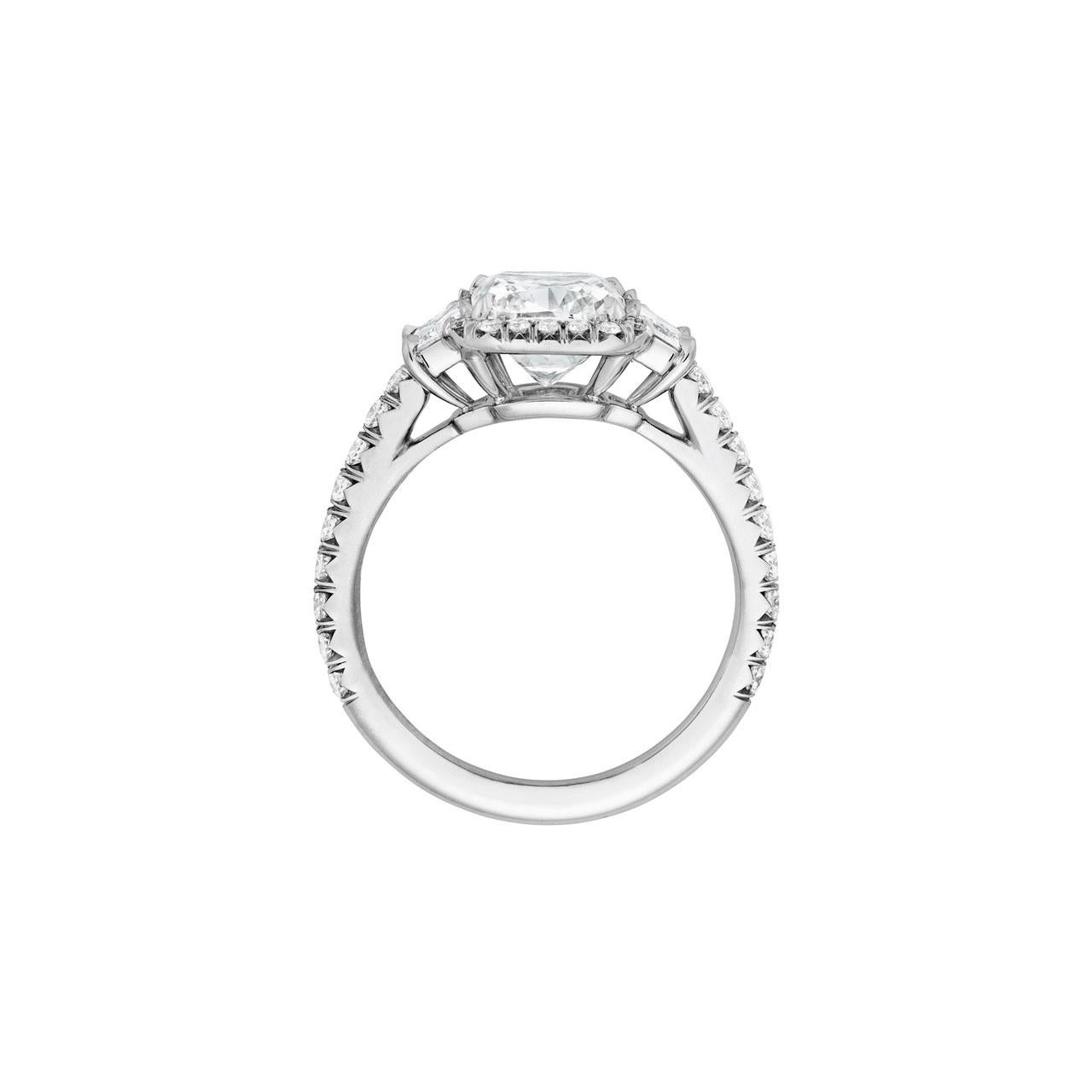 This stunning 2.01 GVS2 GIA certified Cushion Cut Platinum diamond ring is not your typical halo! How about a pair of Brilliant Cut Trapezoids .40 TW to enrich the .41TW FVS small micro pave melee! It is a size 6.25 but can easily be sized. If you