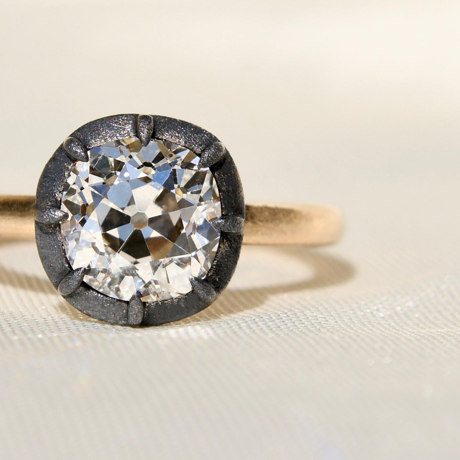 This ring was newly made by Beaubijouxantique.

The diamond is antique from the late 19th century. 

- One GIA certified old mine cut diamond, 7.51 x 7.37 x 5.08/ 2.01 ct (L/ VS2) 
- 750/ 18k solid yellow gold and silver (hallmarked) 
- Ring size: