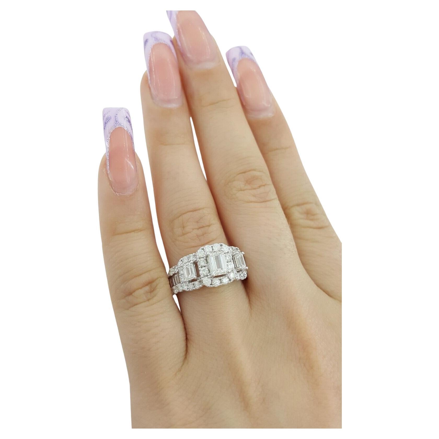 2.01 ct total weight Emerald Cut Diamond Three Stone Halo Engagement Ring in 14K White Gold.
The ring weighs 5.2 grams, size 7, the 3 Natural Emerald Cut center diamonds weigh ~0.87 ct total weight, G-I in color, VS-SI2 in clarity.
There are 14