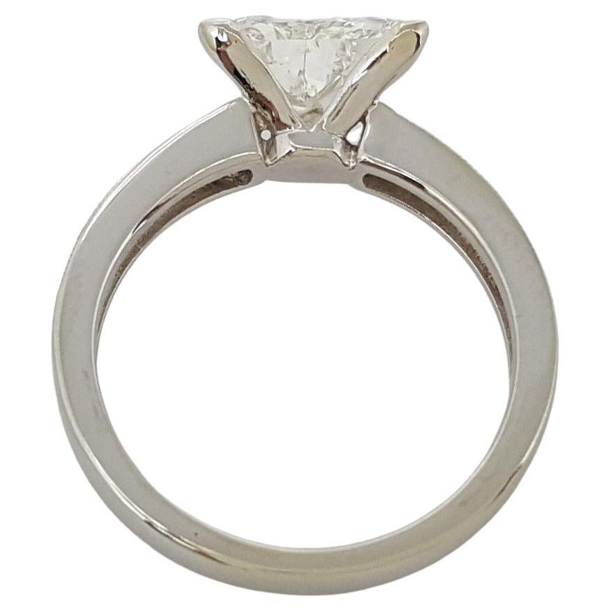 Presenting an exquisite symbol of love and commitment – a 2.01 ct Total Weight Engagement Ring crafted in 14K White Gold. This elegant ring, weighing 4.5 grams and sized at 7.25, showcases a captivating interplay of Triangular and Round Brilliant