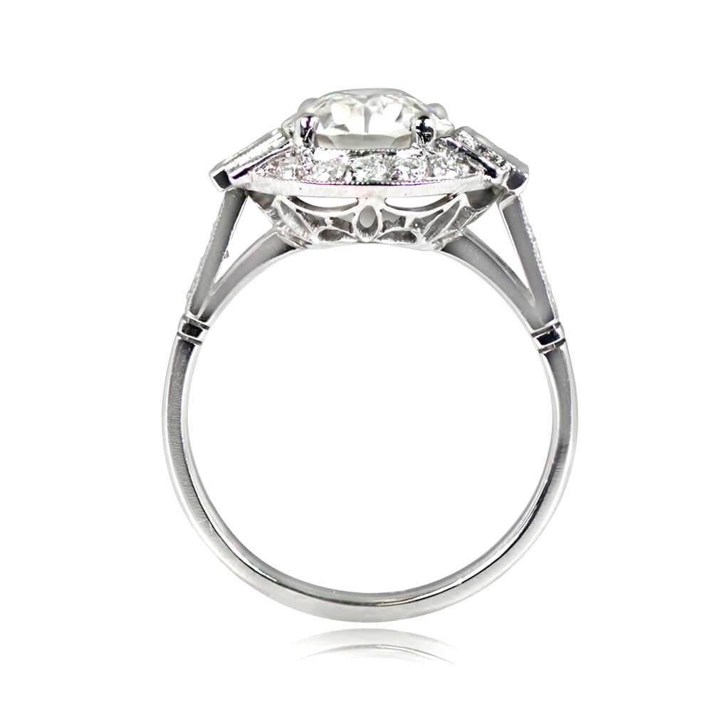 Geometric platinum engagement ring with a 2.01ct J color, VS2 clarity old European cut diamond in prong setting. Three baguette cut diamonds on each side, surrounded by a halo of old European cut diamonds weighing approximately 0.69ct. Features