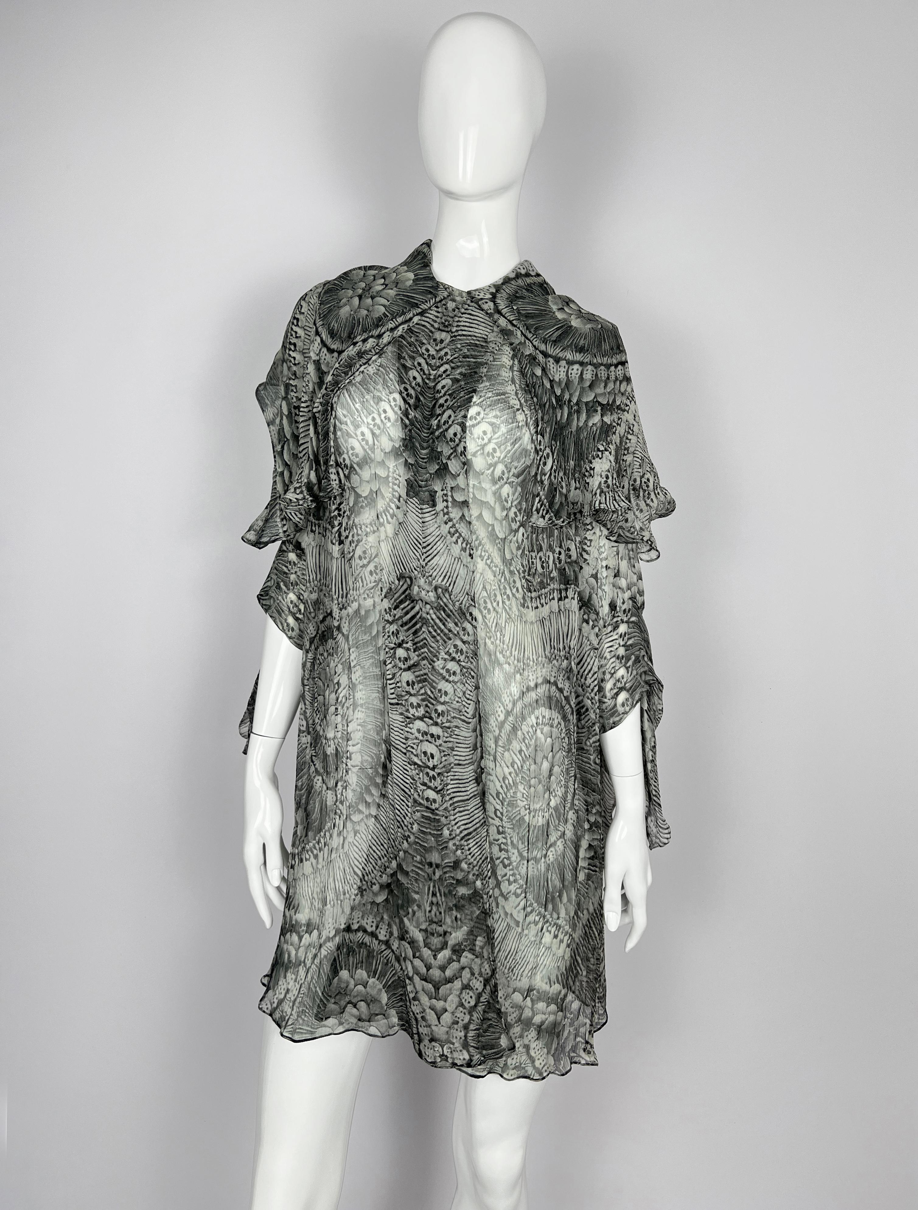 Alexander McQueen
“Catacombs” Skull-Printed Silk Tunic with Attached Scarf
From the iconic Autumn/Winter 2010 “Plato’s Atlantis” collection — Alexander McQueen’s final, visionary runway presentation.

Size: 40 (One Size Fits)
Made in: Italy
Color: