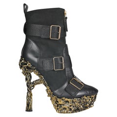 2010 ALEXANDER MCQUEEN Floral-engraved leather boots