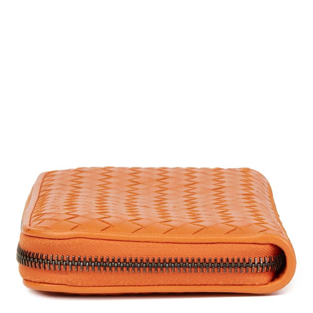 BOTTEGA VENETA
Orange Woven Calfskin Leather Zip Around Wallet

Reference: HB1800
Serial Number: B043866920
Age (Circa): 2015
Accompanied By: Bottega Veneta Dust Bag, Box, Care Booklet
Authenticity Details: Authenticity Tag (Made in Italy)
Gender: