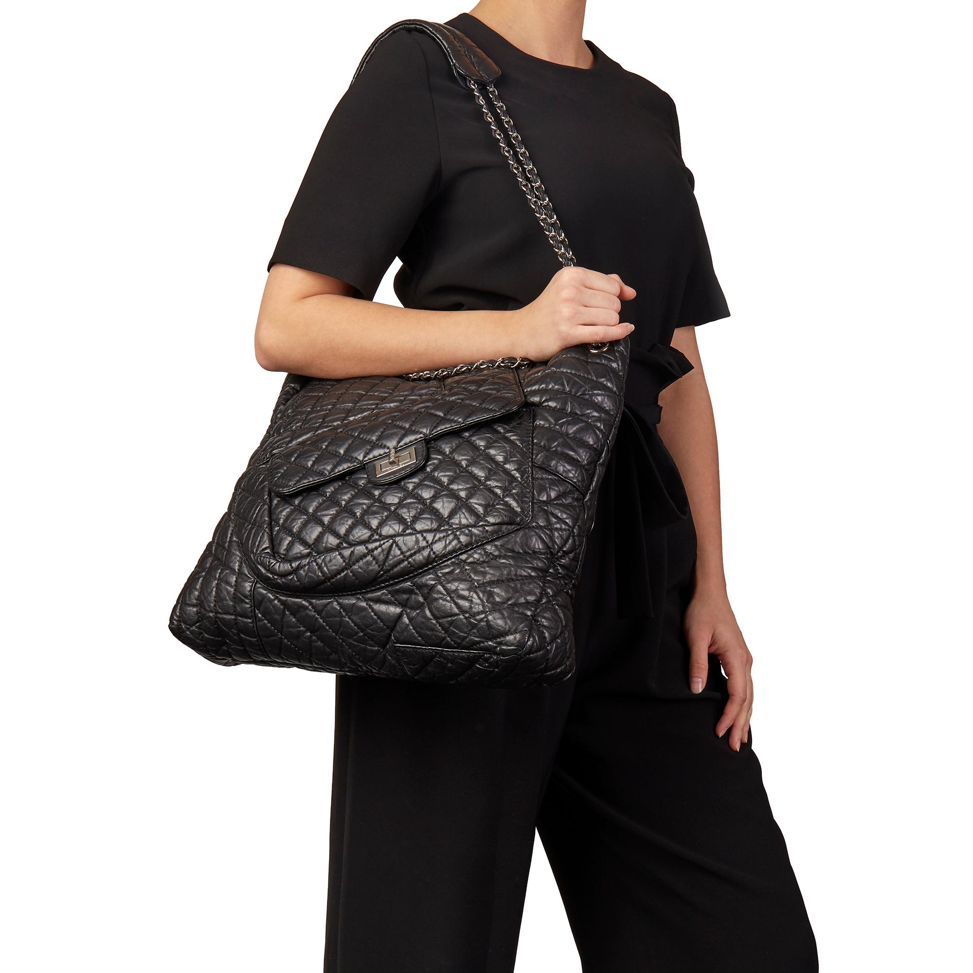 CHANEL
Black Quilted Aged Calfskin Leather Fantasy Shopping  Tote

Xupes Reference: HB3162
Serial Number: 13919799
Age (Circa): 2010
Accompanied By: Authenticity Card
Authenticity Details: Serial Sticker, Authenticity Card (Made in Italy)
Gender: