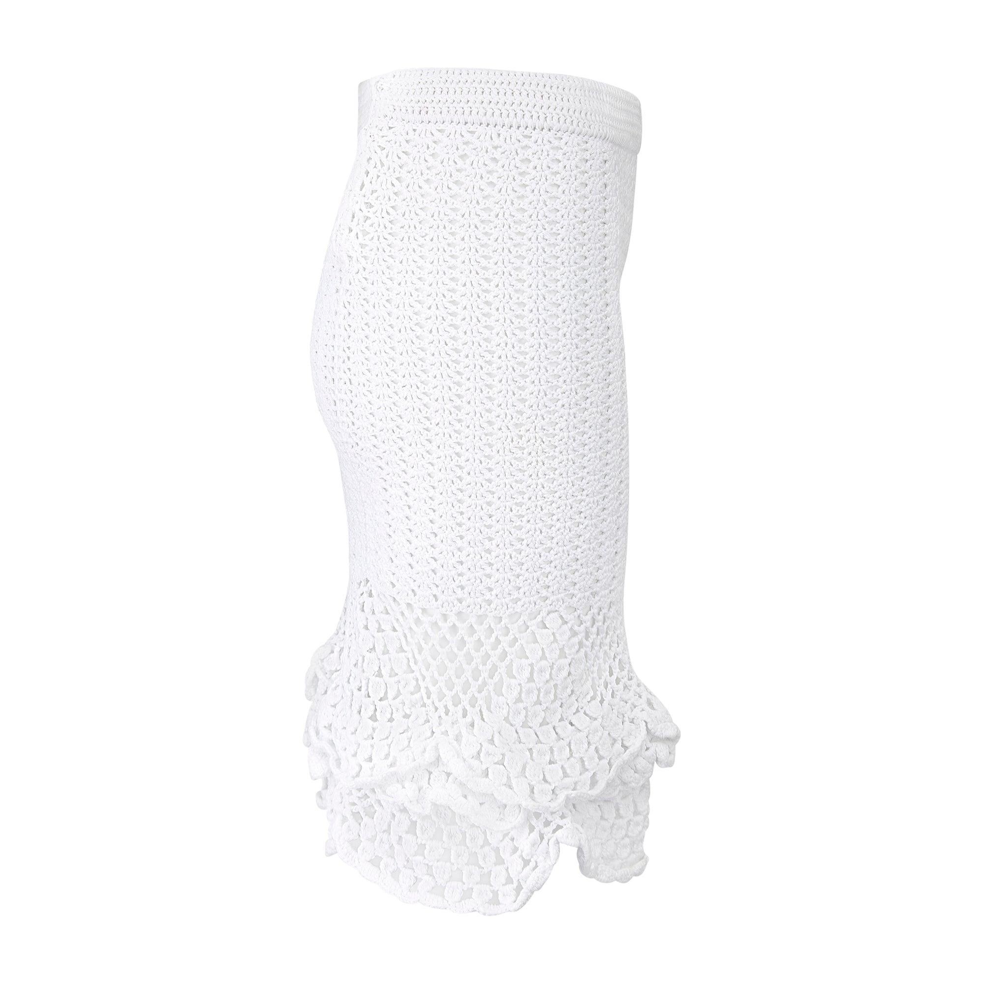 This skirt is from Dolce & Gabbana's highly glamorous mainline collection and walked the runway for the design duo's 2010 spring presentation, look 42 of 63. Crochet knitting, which can only be made by hand, has long-been a beloved signature of the