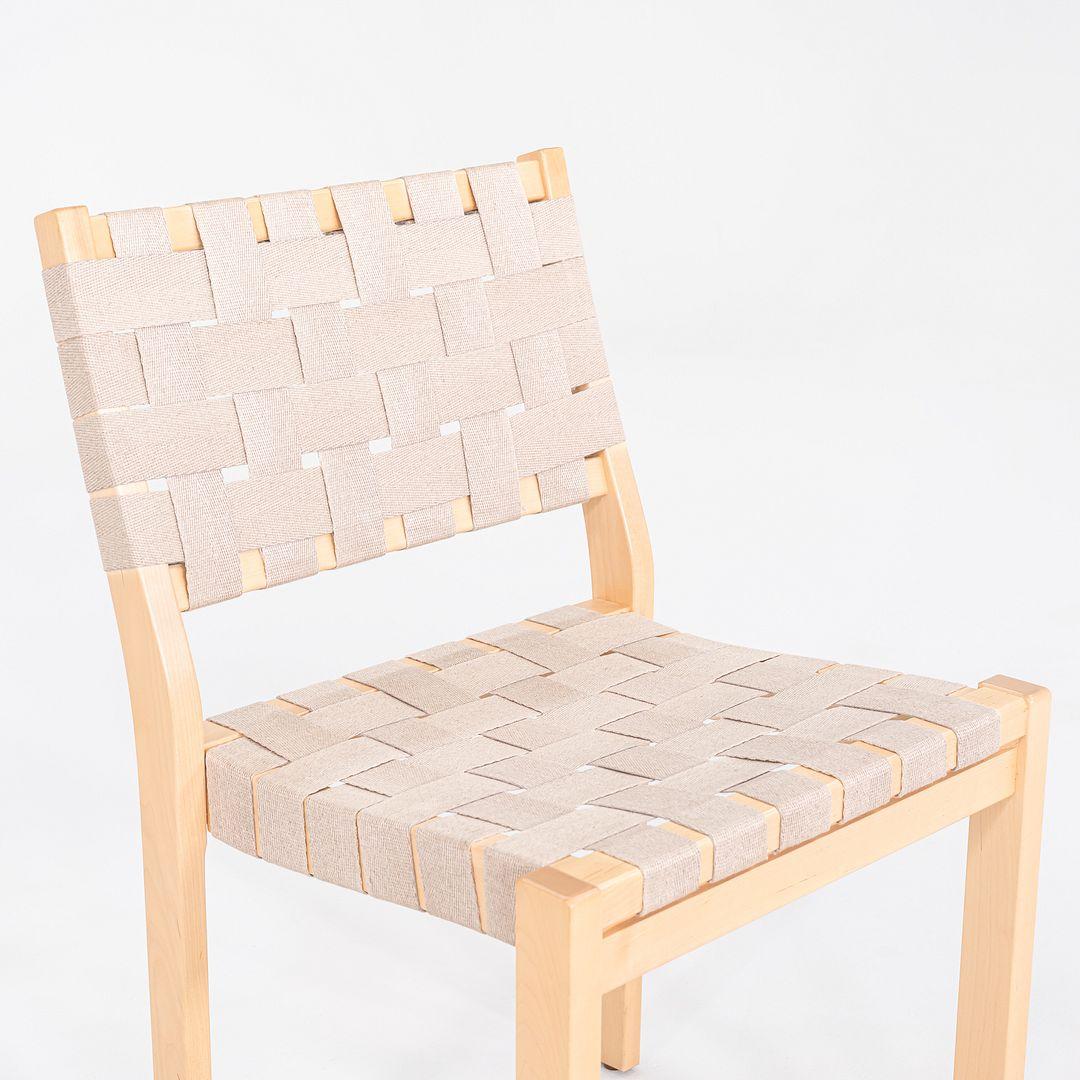 This is a pair of 611 Stacking Chairs, originally designed by Aino and Alvar Aalto in 1929. These particular examples were produced by Artek in Finland in 2010. Their frames are made from birch, which is then lacquered, and the chairs are