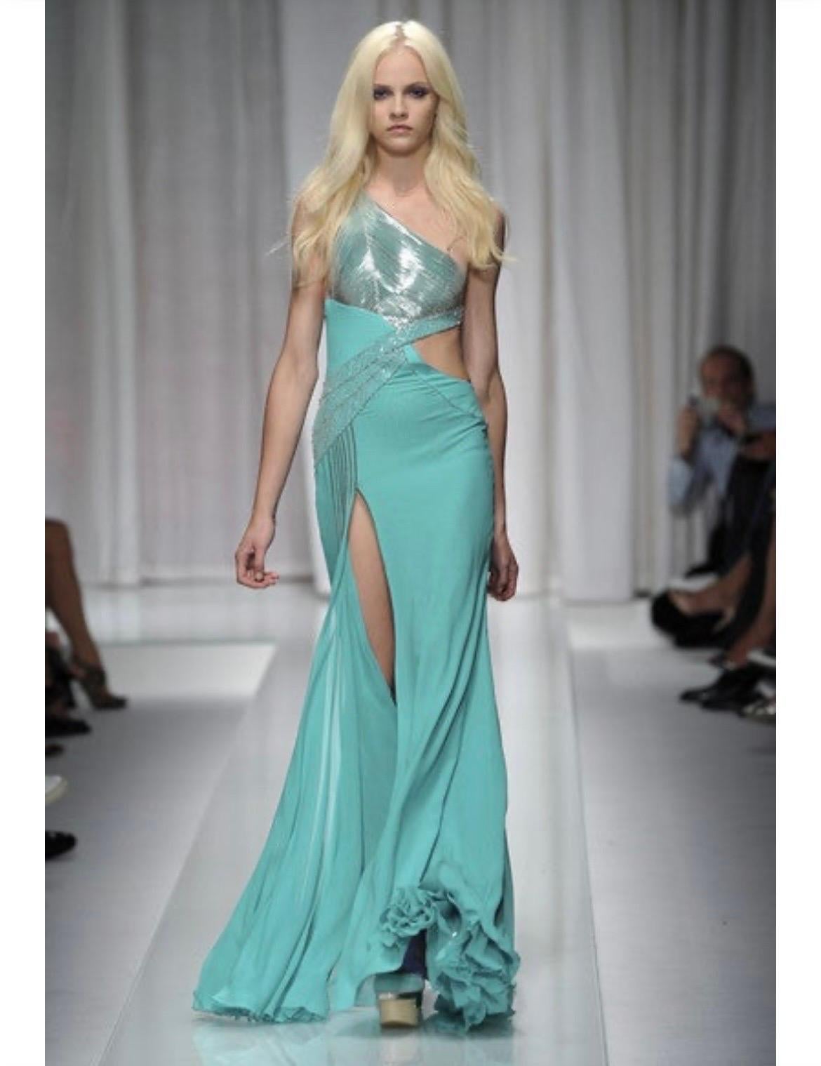 S/S 2010 VERSACE 
The sensational color, one-shoulder design, artfully embellished body and fluid   skirt - which allows effortless movement - ensure  a stunning silhouette    
Color: Aquamarine  
Content: 100% silk  Lining: 64% silk, 30 %