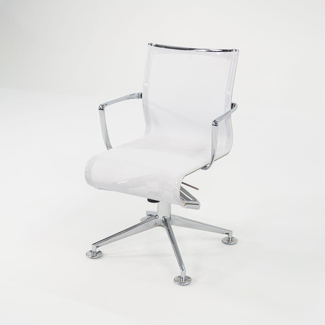 This is the Meetingframe Tilt 47 / 447 Swivel Desk Chair, designed by Alberto Meda for Alias Italy. These particular examples were produced in the 2010s. The frame of this piece is made of chromed aluminum and has die-cast aluminum elements,