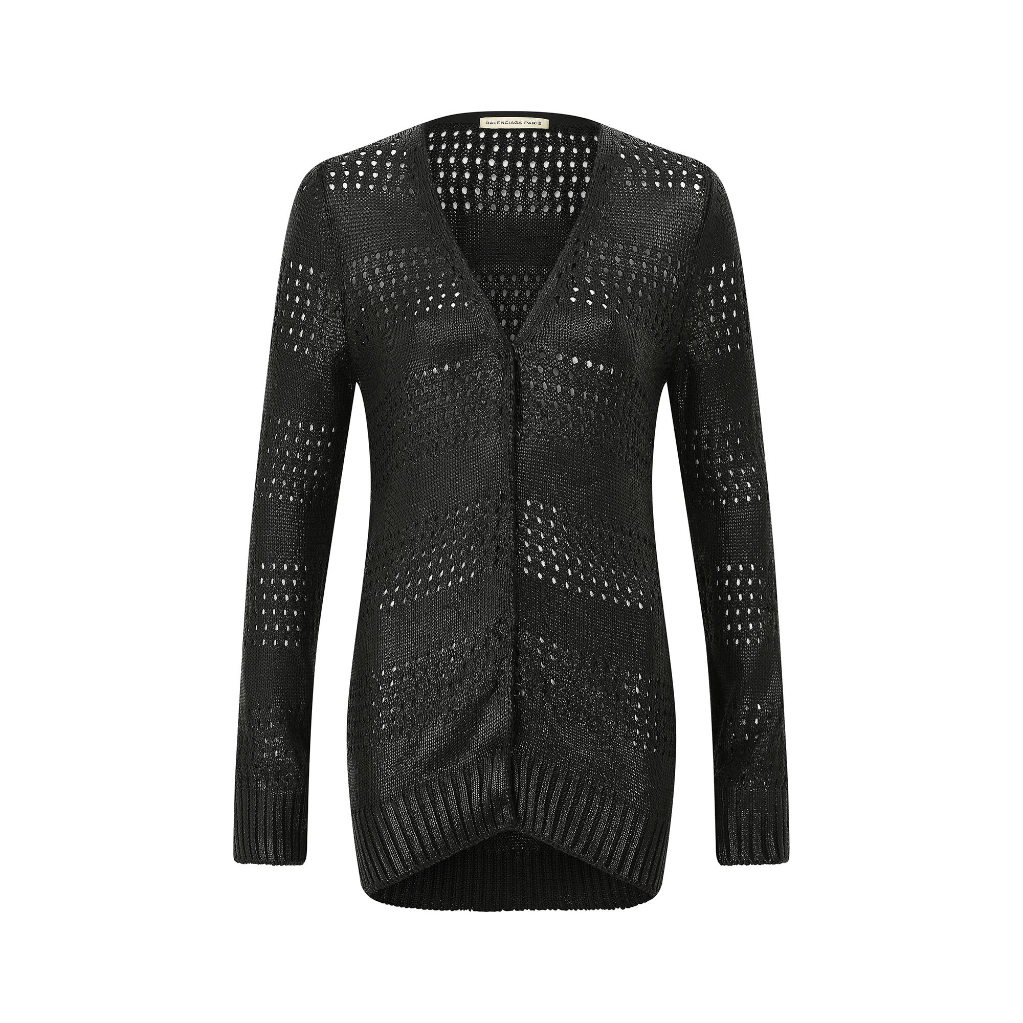 2010 long black knitted cardigan by Nicolas Ghesquière during his time as creative director at Balenciaga.  It has a superb alternating knit design that features horizontal rows of both plain and open style bands.  It has a V-neck and is front