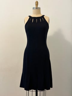 2010s Chanel Black Cocktail Dress With Keyhole Neckline and Pleated Skirt Detail