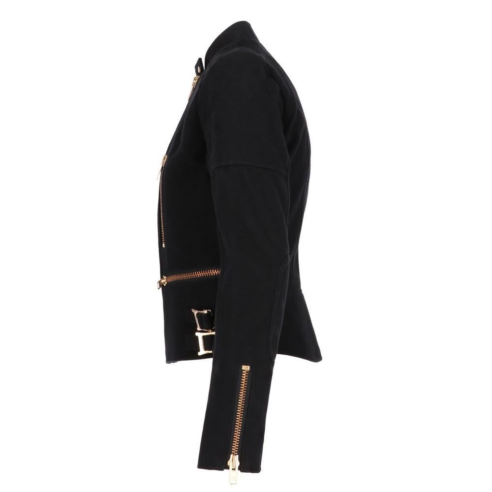 Chloé black cotton  jacket  with golden metal details. Raised collar with snap button and off-center zip closure. Welt pockets with zip, four side straps and quilted topstitching on shoulders and elbows. 

The product shows a faulty buckle as shown