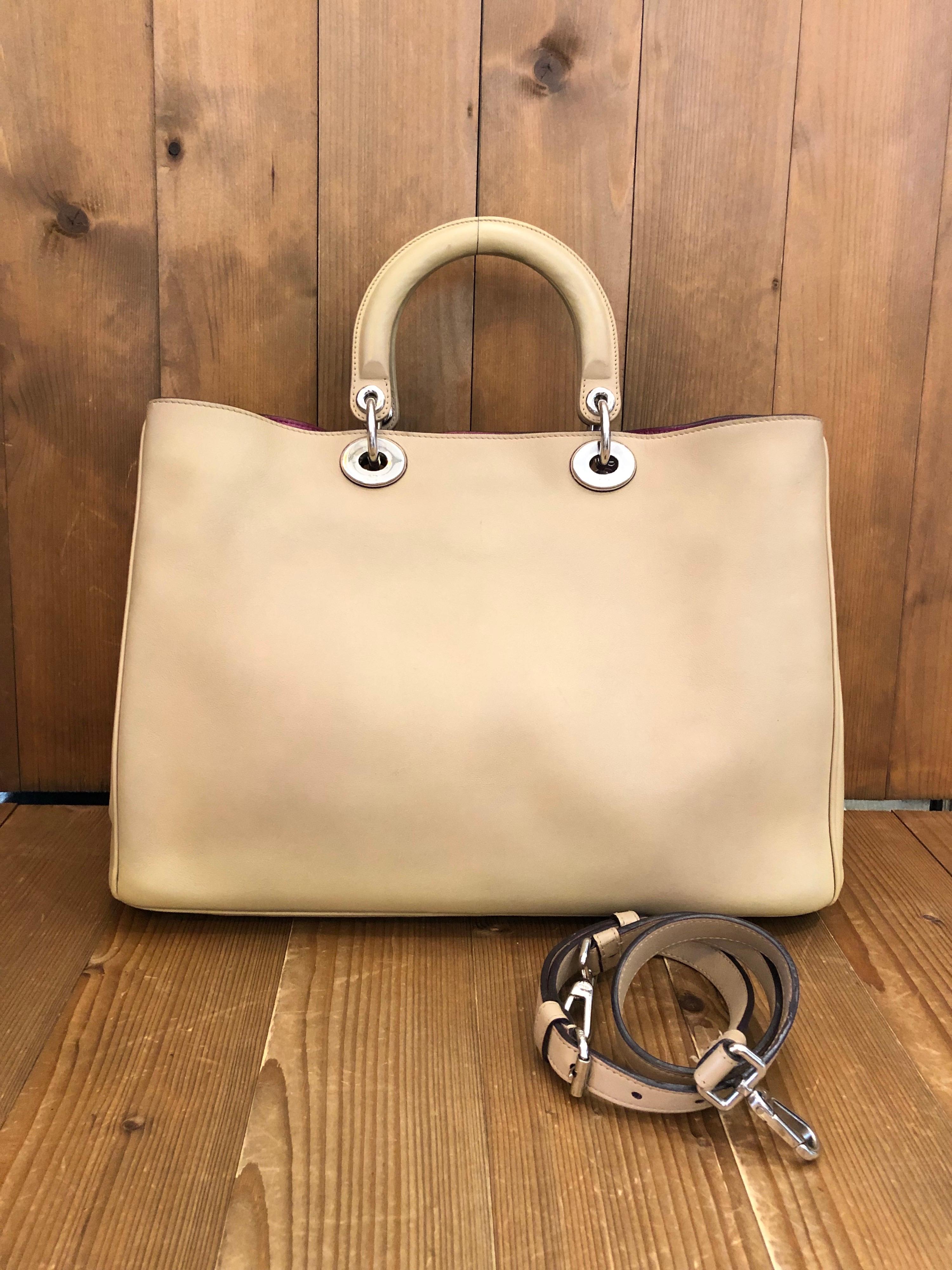 2010s Christian Dior shoulder tote bag in beige leather and silver hardware featuring two interior open pockets. Made in Italy. Measures 15 x 10.25 x 5 inches 
Strap length 33 inches. Comes with shoulder strap.

Condition: Minor signs of wear.
