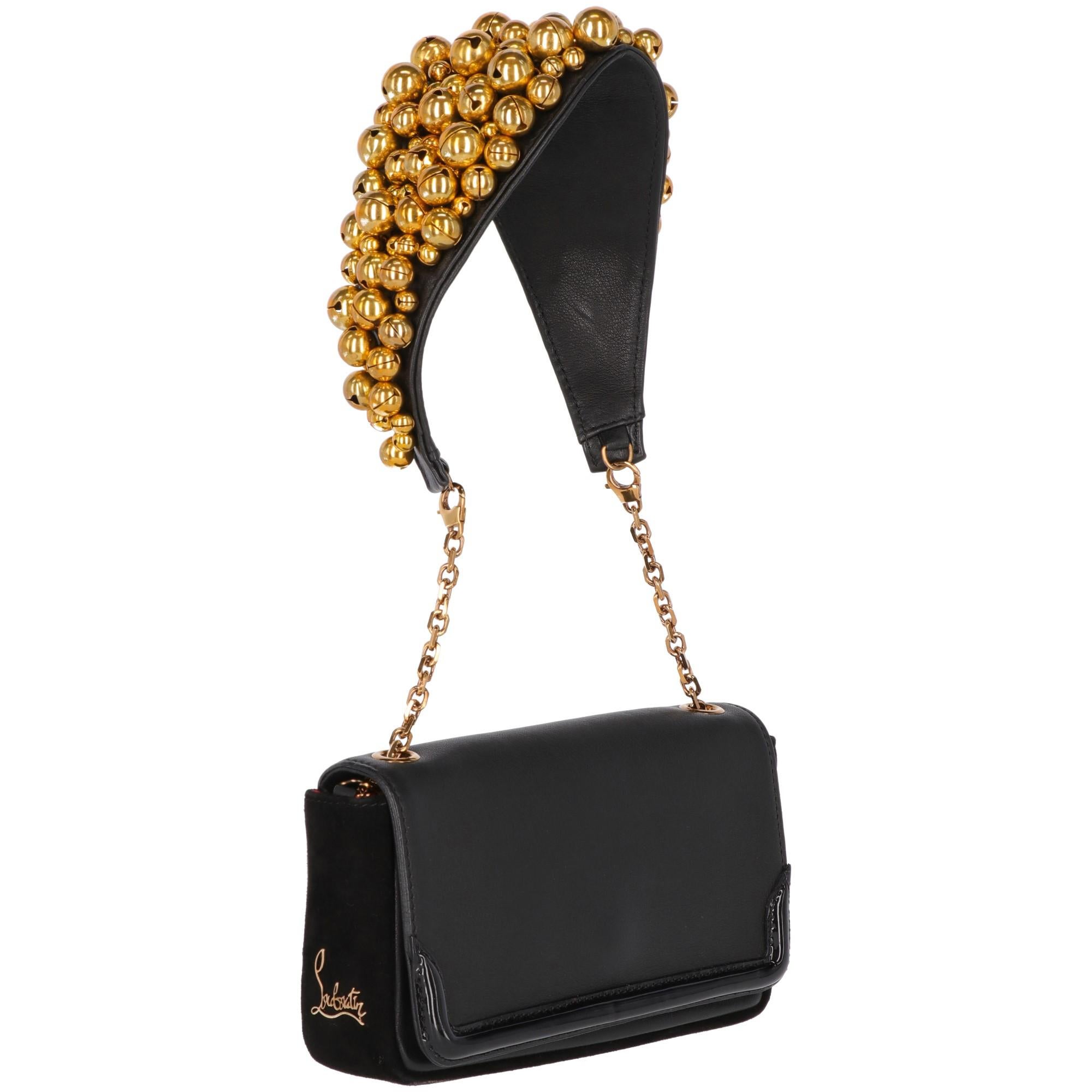 The stylish Artemis Clochettes shoulder bag by Christian Louboutin, is in black calf leather with suede and patent leather inserts. The shoulder strap is in golden chain with a leather insert embellished by golden metal small bells. The Louboutin