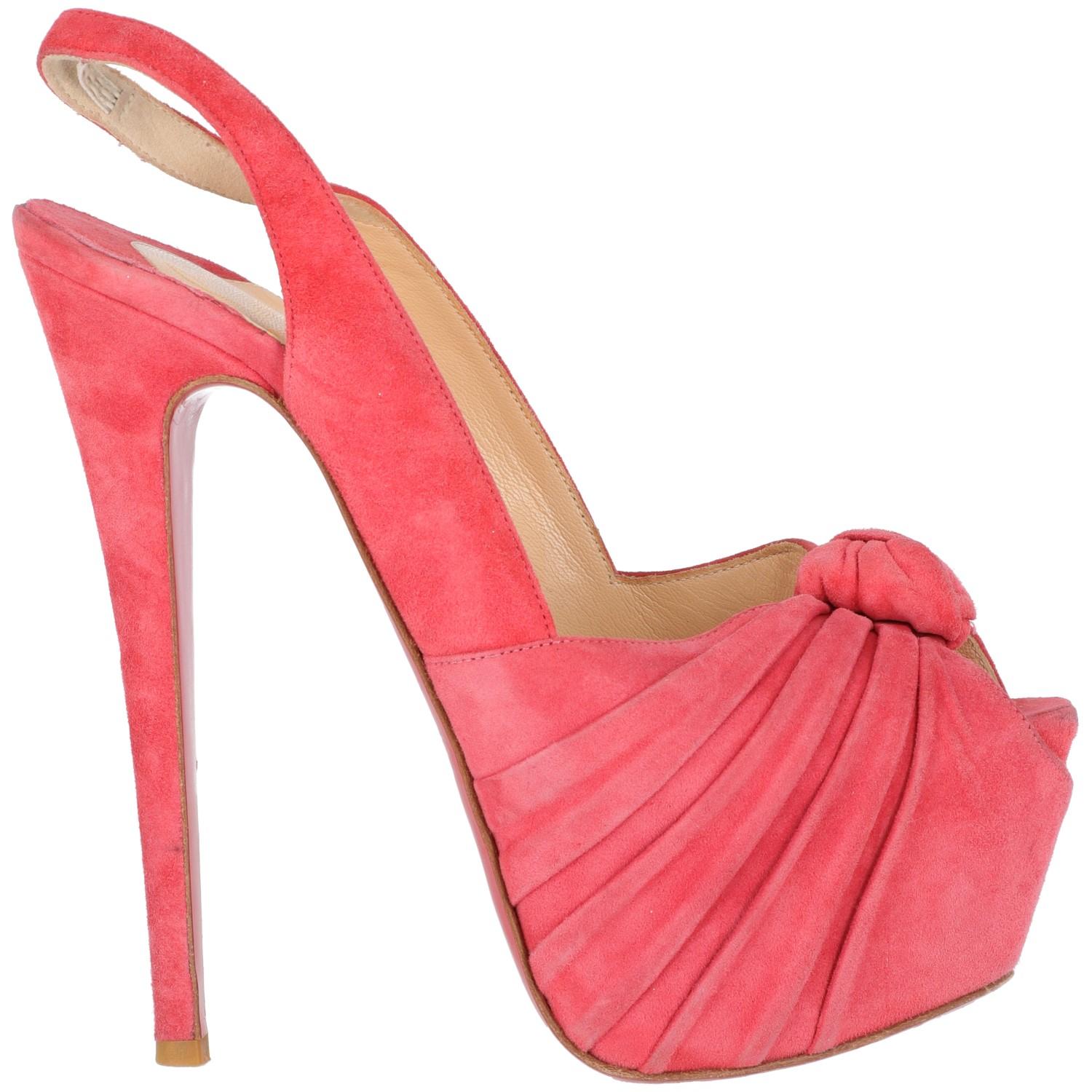 The lovely Christian Louboutin flamingo pink suede sling-back sandal features vertiginous 16cm spike heels and 5.5 cm plateau. With open toe and embellished by a fancy decorative detail.
The item shows light scratches at toe and at heels, as shown