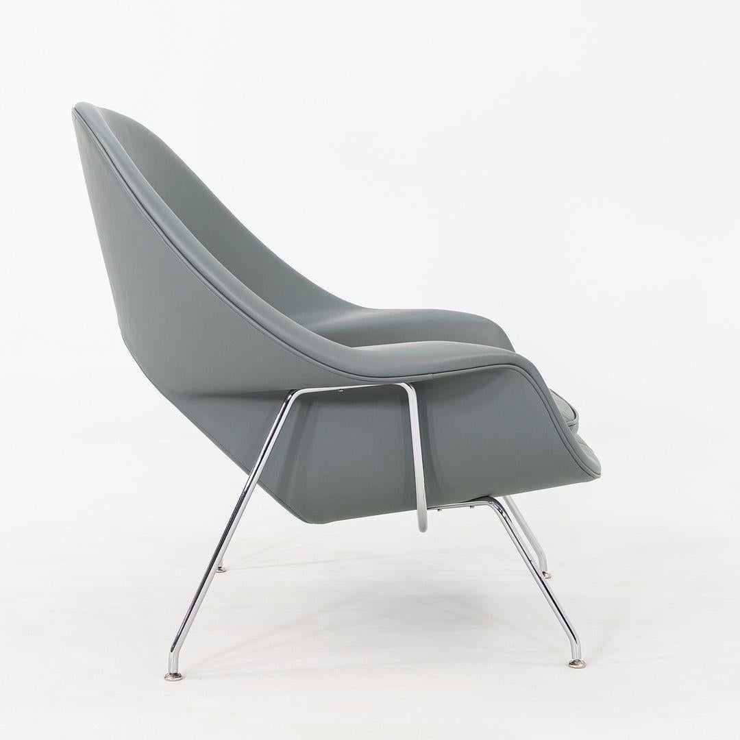 This is a medium-size Womb Lounge Chair, originally designed by Eero Saarinen for Florence Knoll and Knoll Associates in 1948. These particular examples were manufactured by Knoll in the USA in the 2010s. These pieces feature a seat that is formed