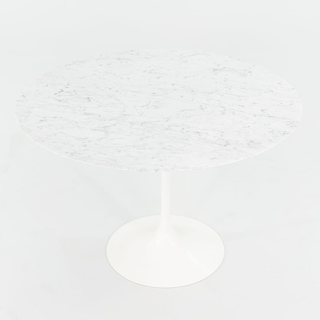 This is a Pedestal Tulip Dining Table, Model 173F, initially designed by Eero Saarinen for Knoll in 1956. These particular tables were produced in the USA in the 2010s. The listed price includes one table, and we have two available for purchase. The