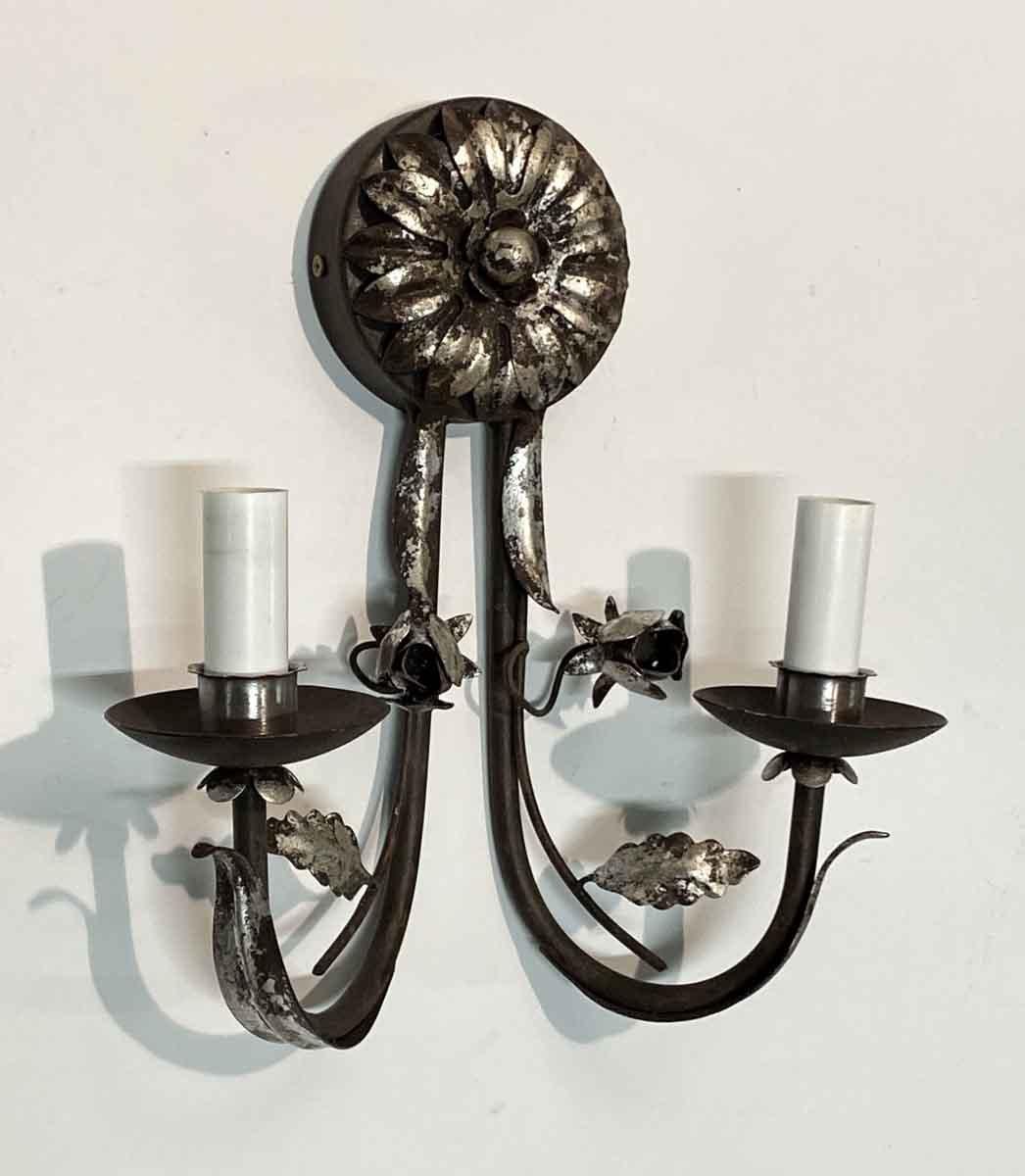2010s Florentine handwrought iron sunflower sconces with a silver gilt finish. Takes two 60 w candelabra bulbs. Priced each. Wired and ready to ship. Small quantity available at time of posting. Priced each. This can be viewed at our Scranton,
