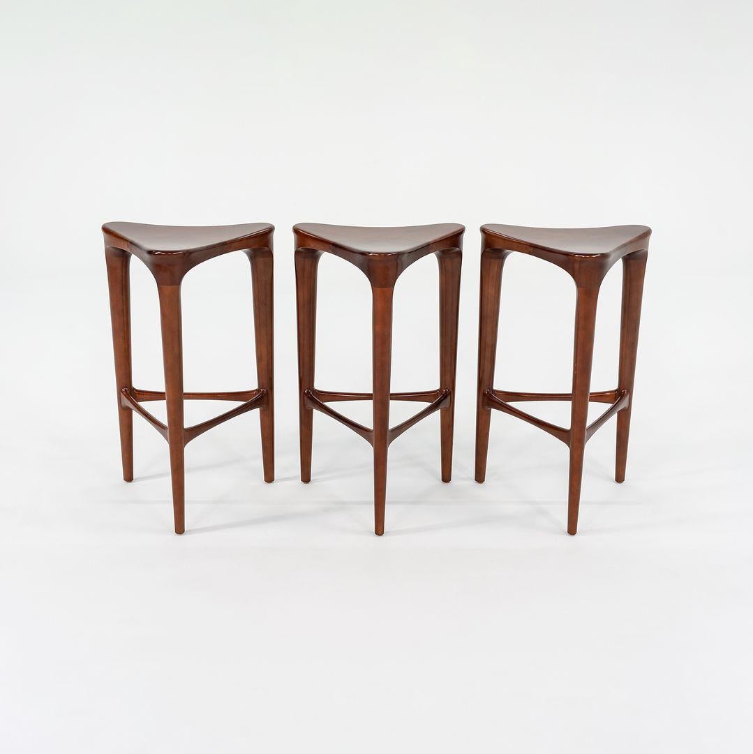 These are 2 BY 3 Counter stools, designed by Ai3 Designs for Geiger. They date to the 2010s. The listed price includes one stool, and we have eleven of them available for purchase. These stools were beautifully crafted from solid cherry wood, and