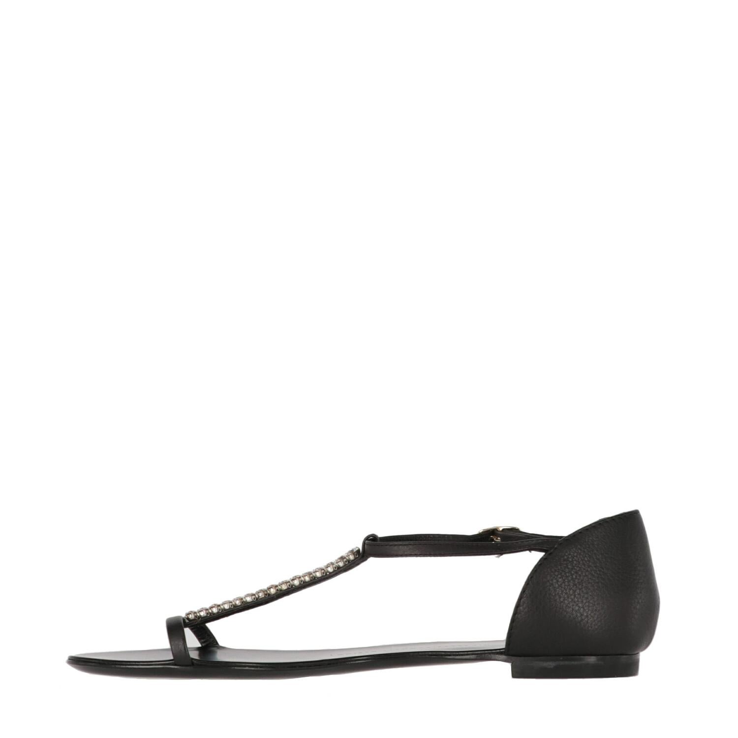 A.N.G.E.L.O. Vintage - ITALY

Giuseppe Zanotti black genuine leather flat sandals. Front thin band, ankle T-strap fastening, rhinestones embellishment and covered heel.

The item shows slight signs of wear on the insole, as shown in the