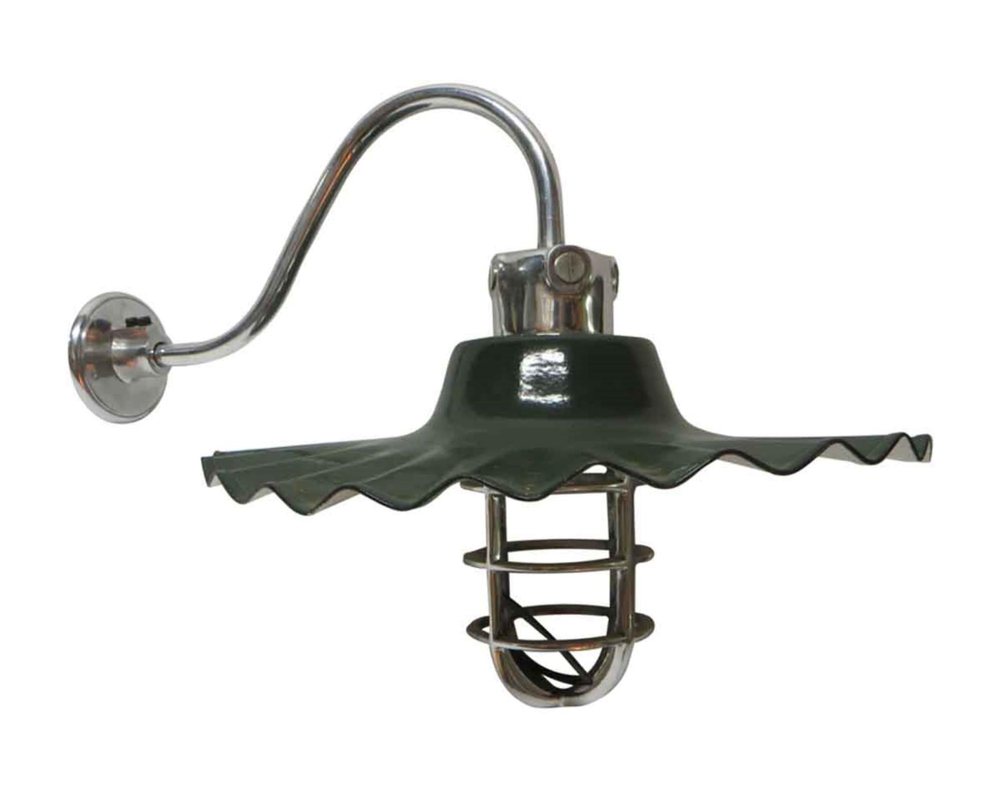 2010s green enameled steel ruffled shade with a nickel over brass arm and cage for the light bulb. This is a quality reproduction of an early 20th century style. This can be seen at our 400 Gilligan St location in Scranton, PA