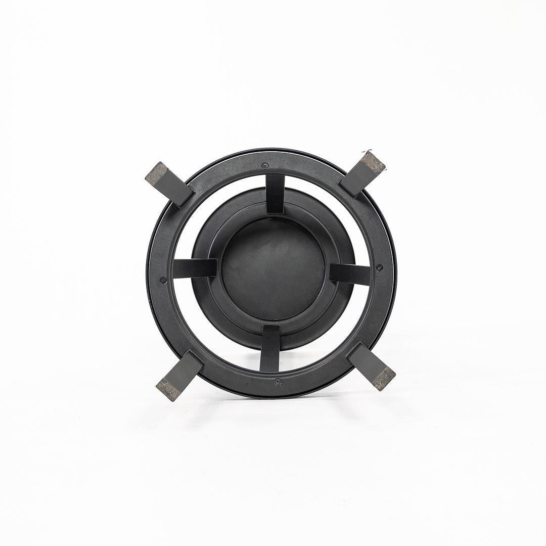 This is a Revolver bar stool. The style was originally designed by Leon Ransmeier, and these particular examples were produced by Hay in Denmark in the 2010s. The stools are comprised of powder coated steel and have aluminum bearings allowing them